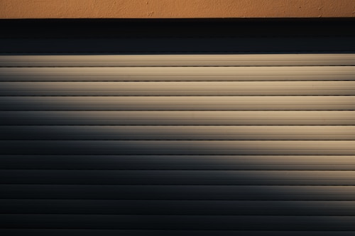 Motorised security roller shutter