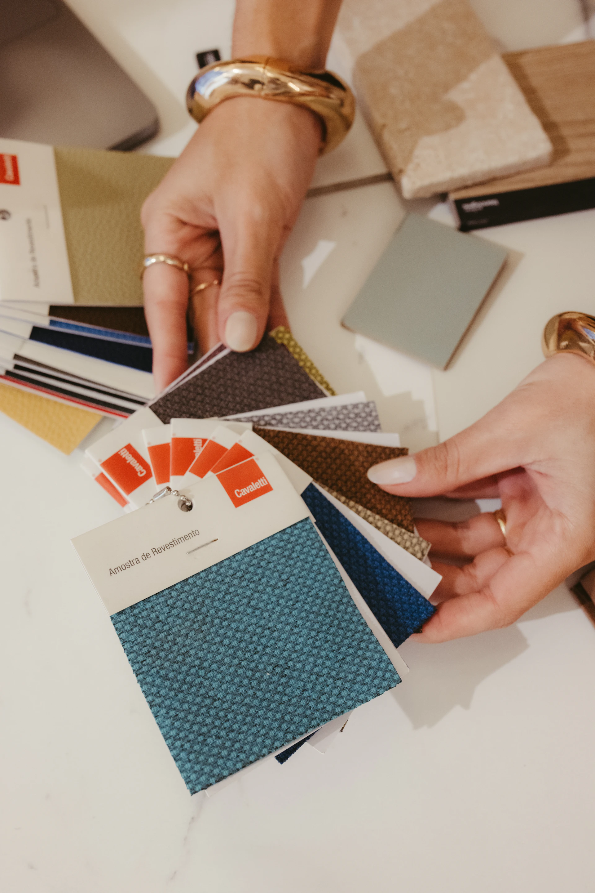 Interior designer selecting fabric and material samples for a fit-out project