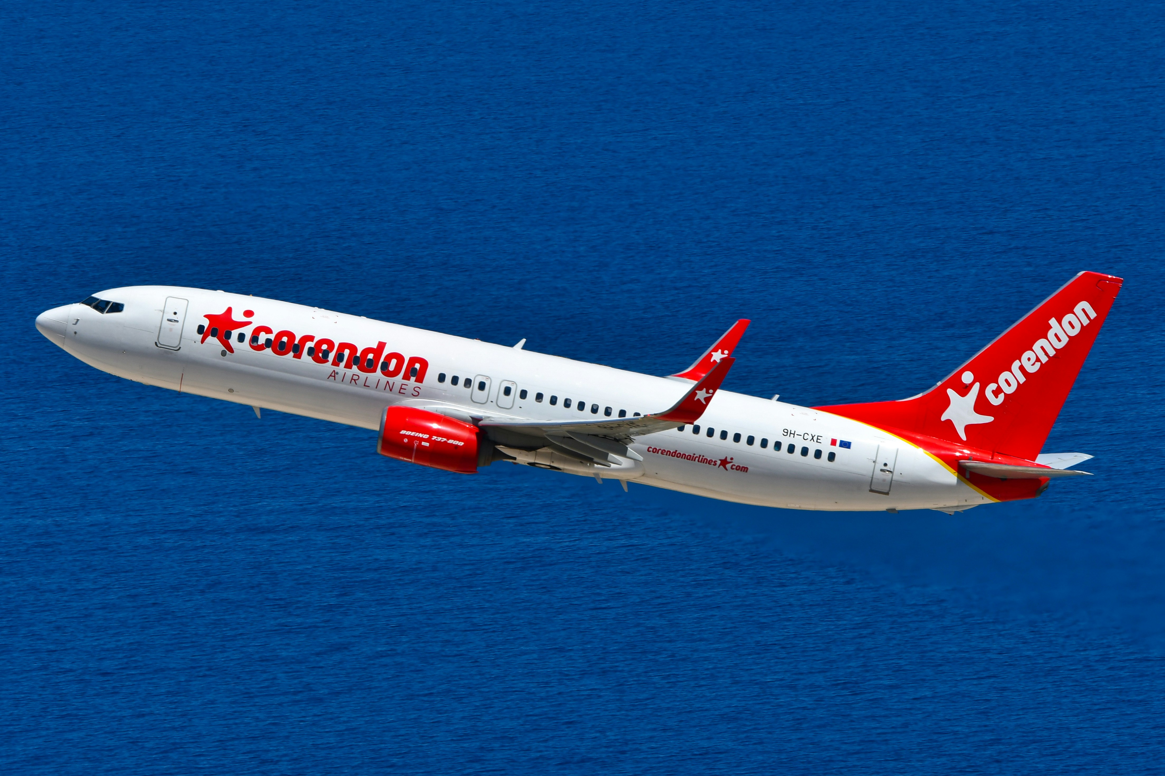 Corendon airplane flying against a blue background
