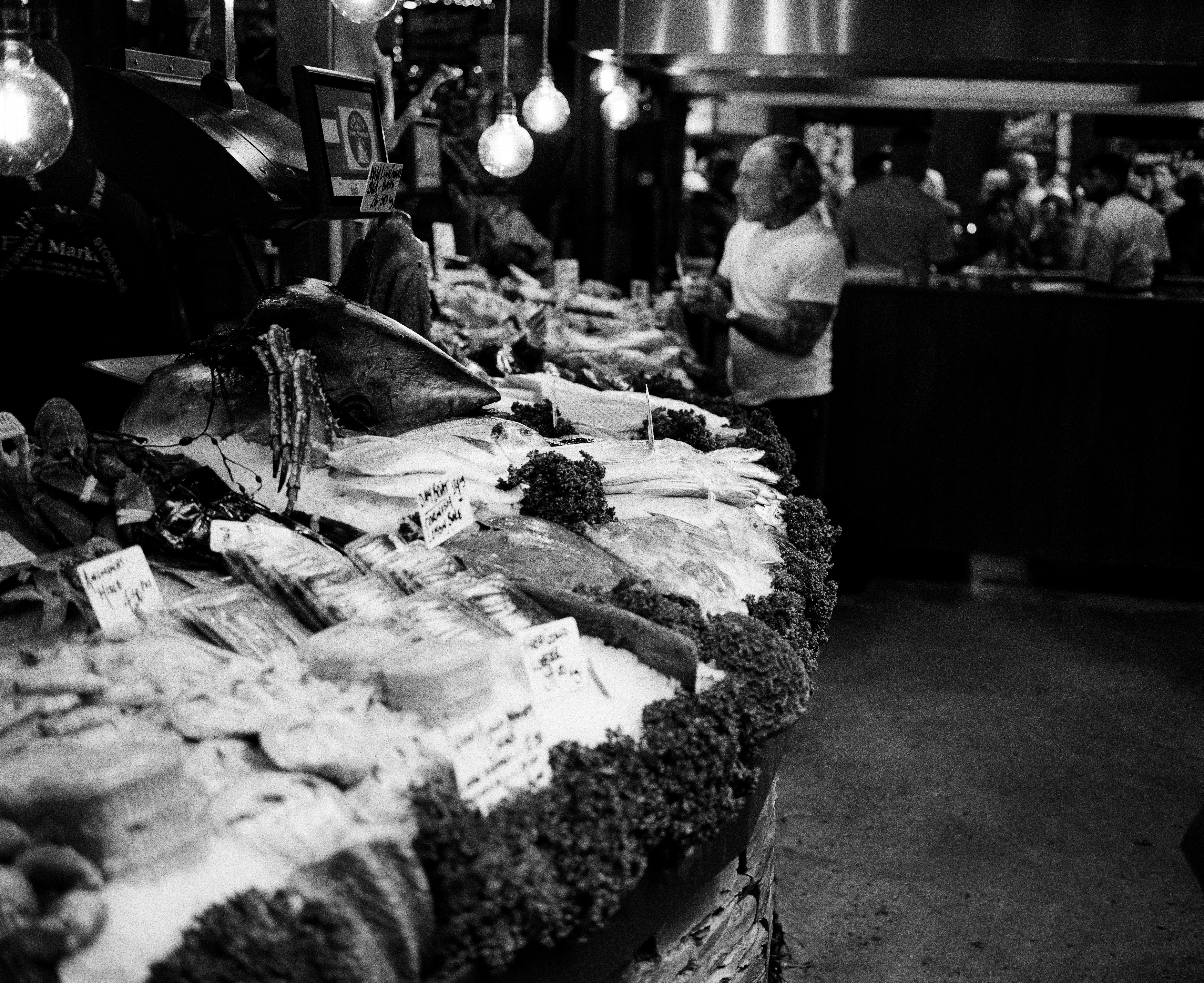 Black and white market fish stall