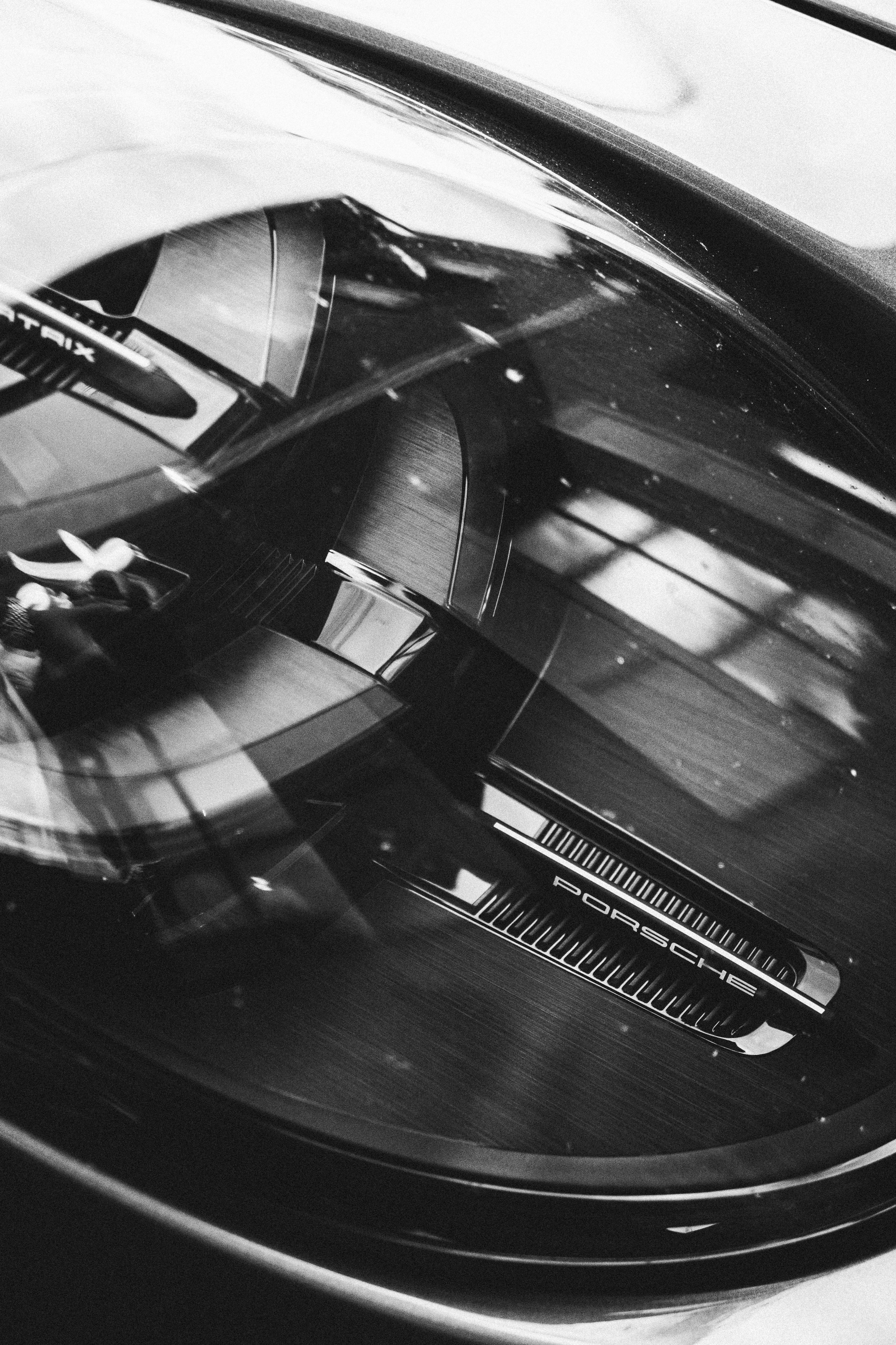 Reflective porsche car headlight in black and white