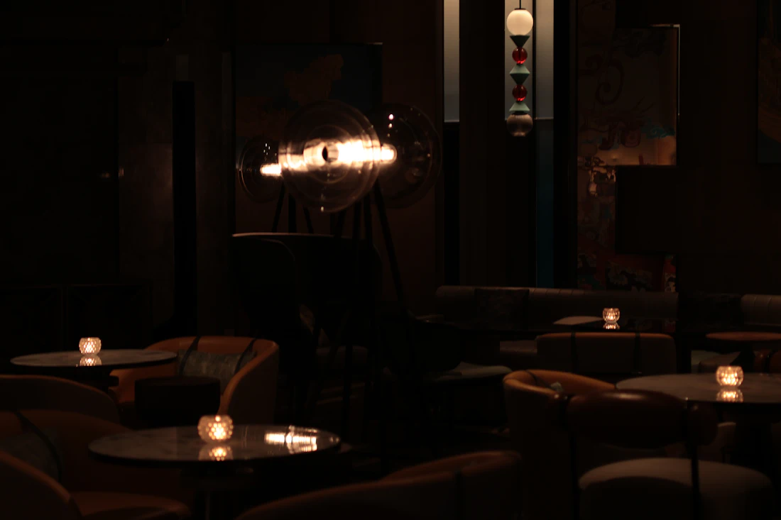 The library bar after dark, candles lit on every table