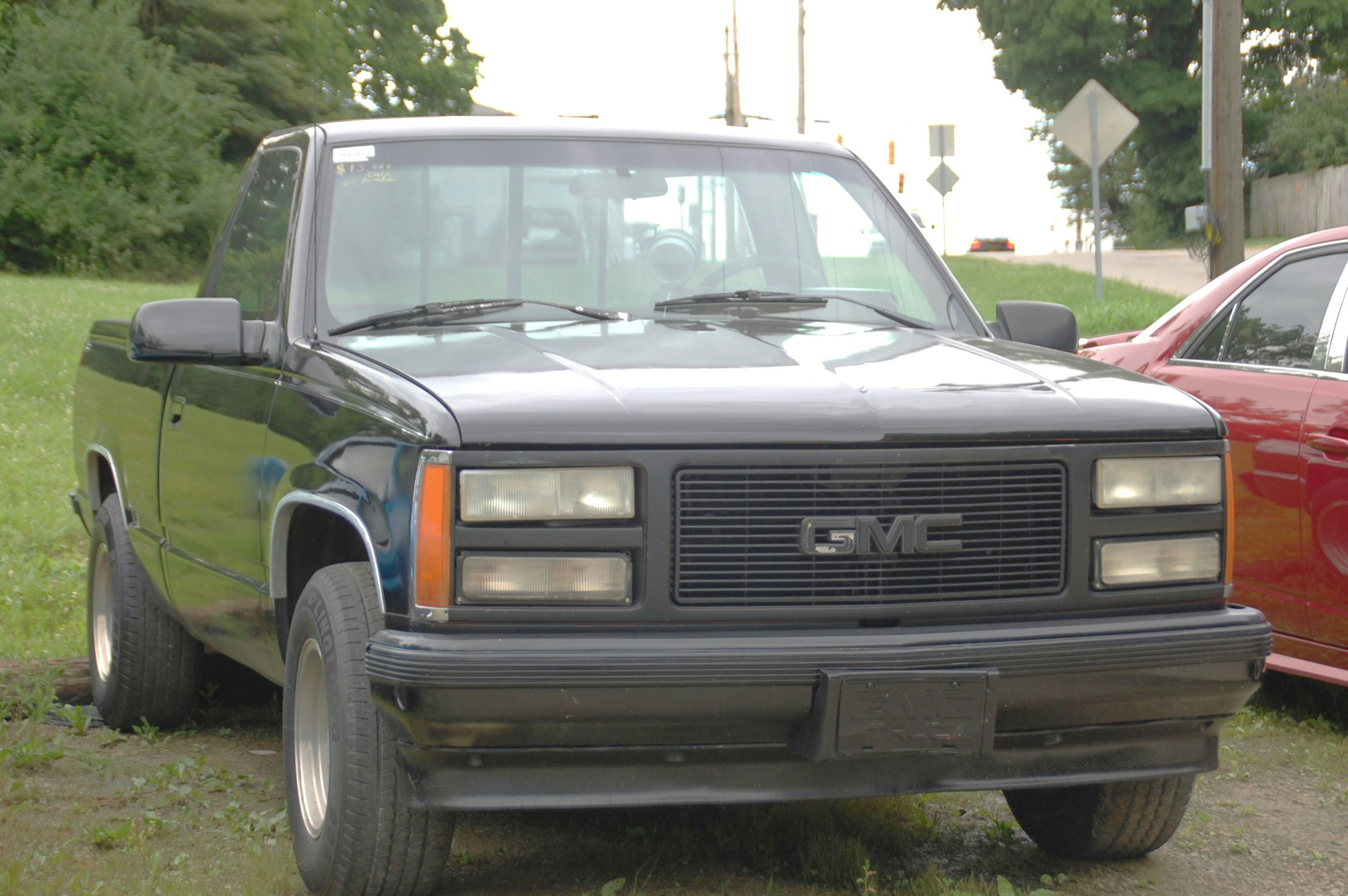 A black GMC pickup truck parked outdoors