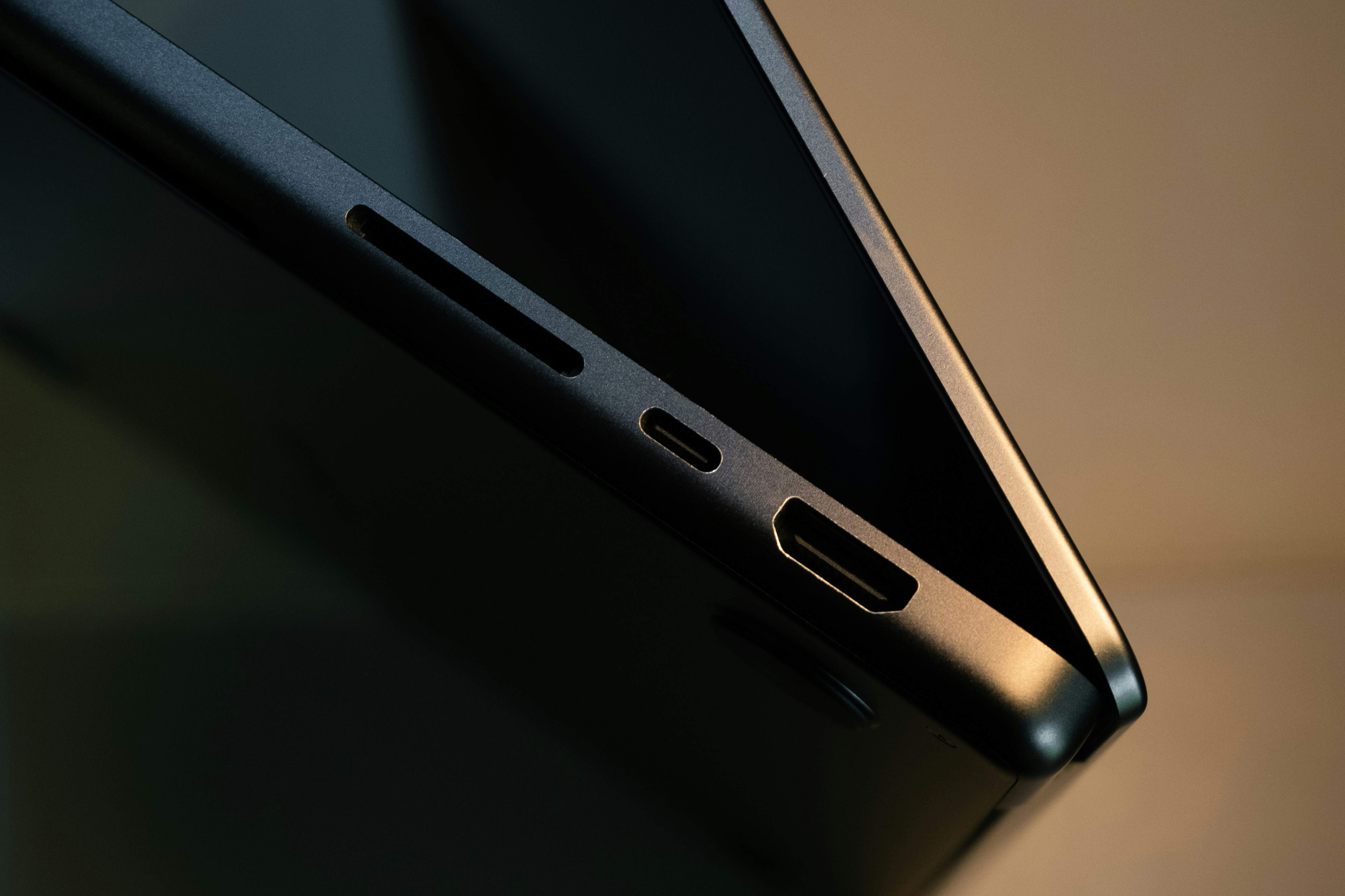 Dark electronic device side with usb-a, usb-c, and hdmi ports.