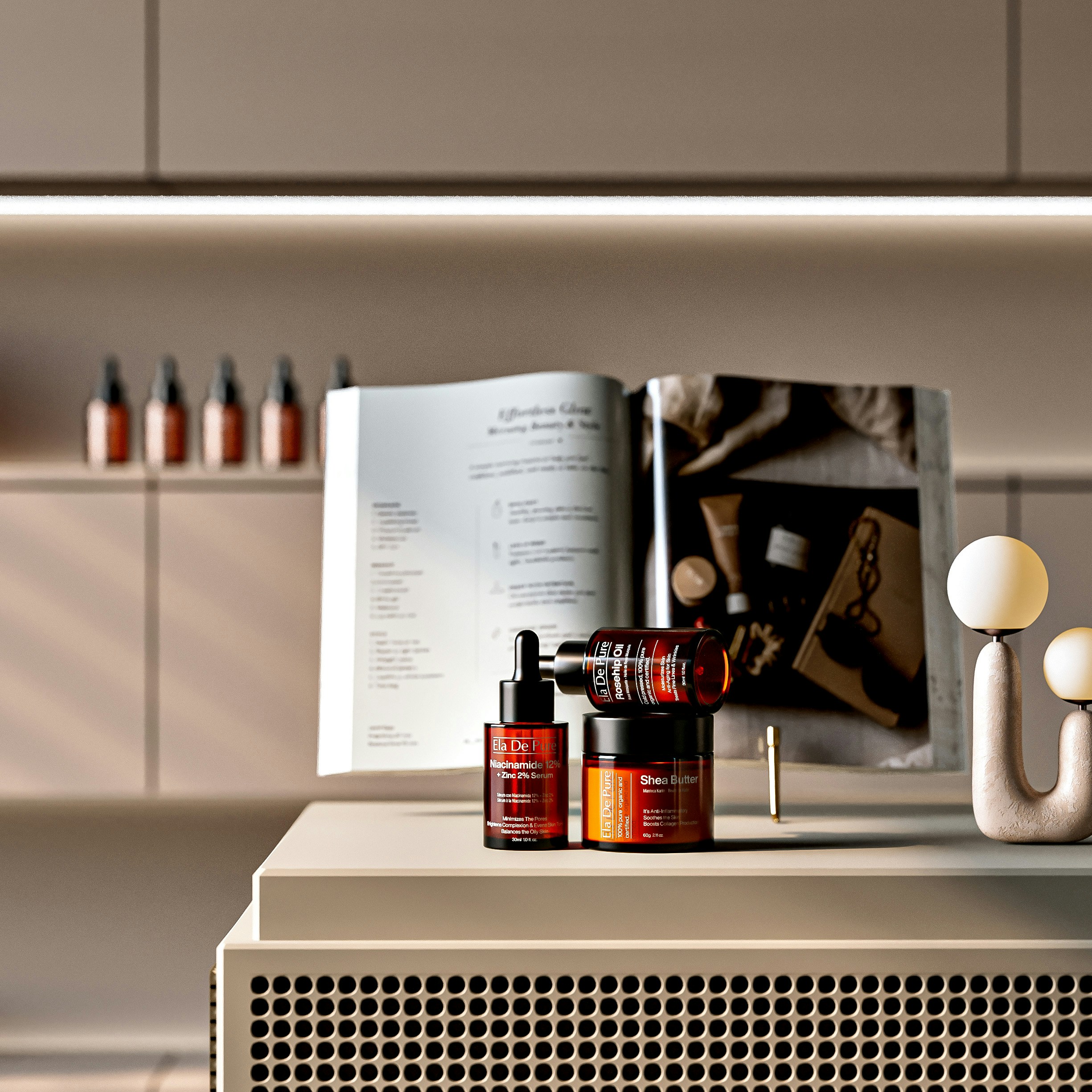 Bottiglie cosmetiche e un libro aperto su un bancone moderno.