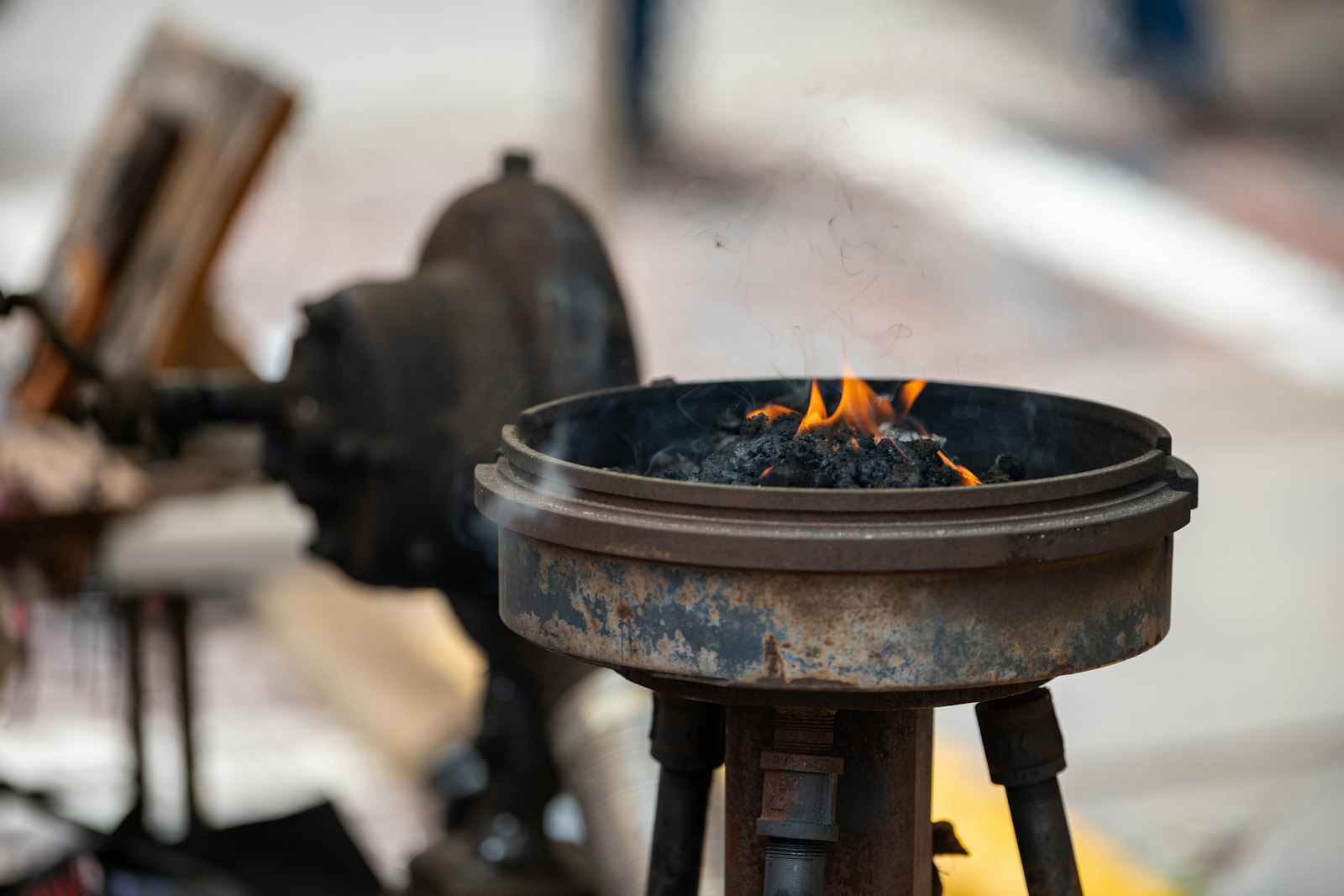 Burning coals and flames inside the forge