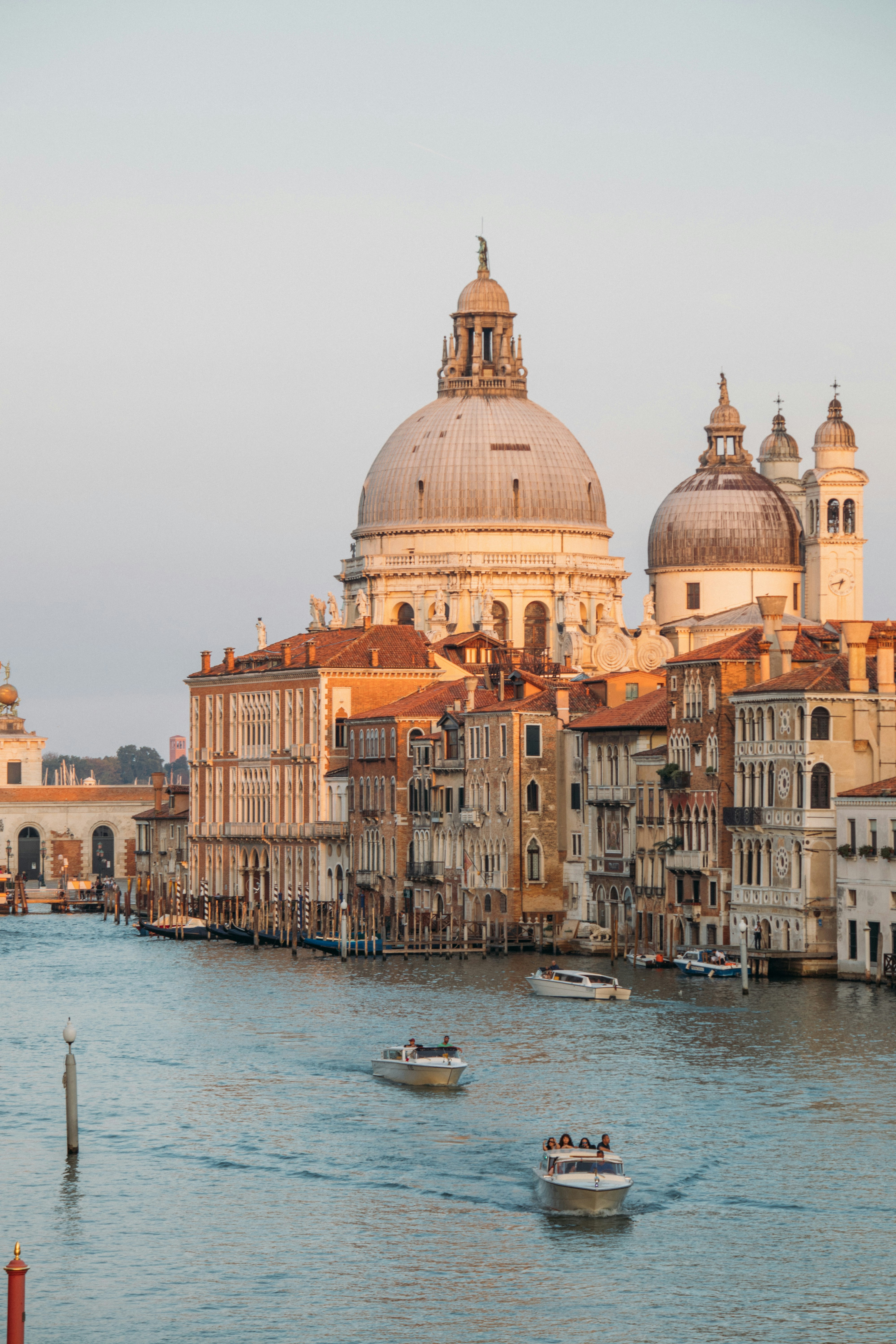 Boats on venice's grand canal with santa maria della salute.