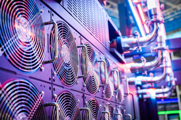 Close-up of server cooling fans in a vibrant data center.