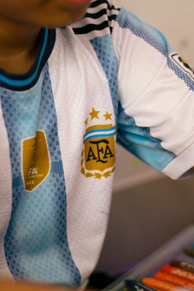 A person wearing an argentina national soccer team jersey.