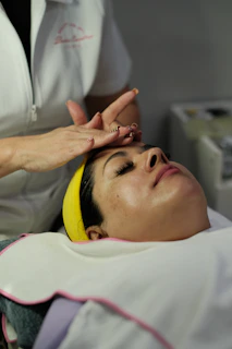 Woman receiving a facial treatment at a spa