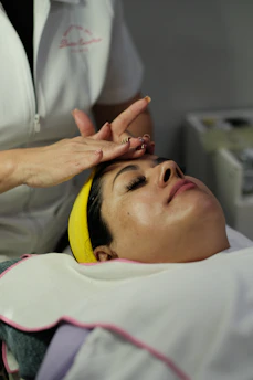 Woman receiving a facial treatment at a spa