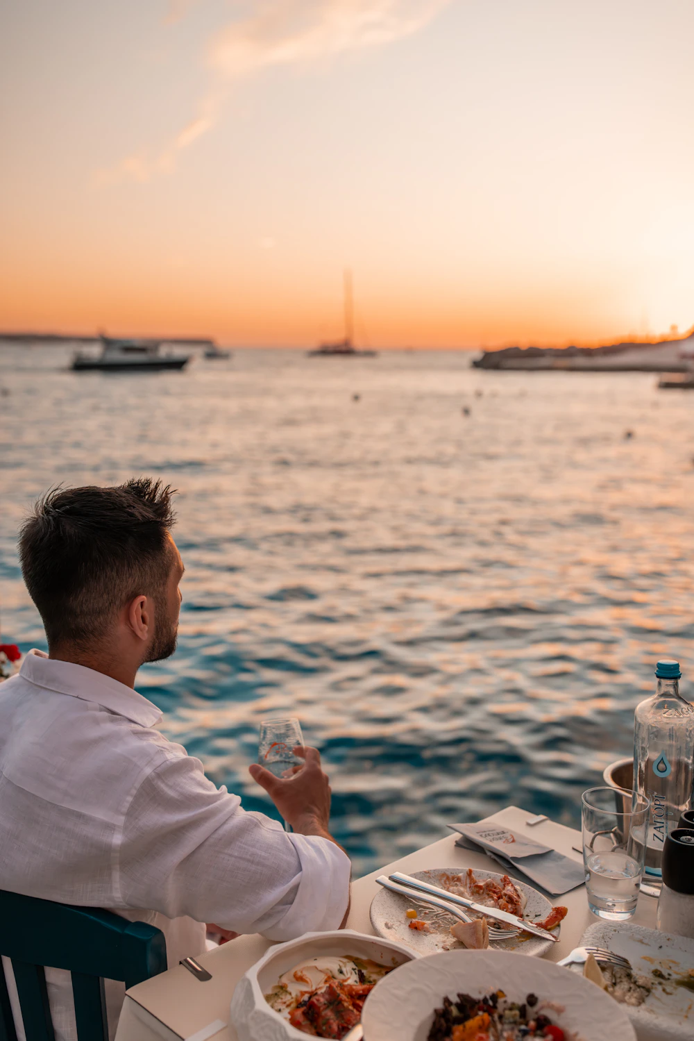 Evening by the sea with a glass of wine