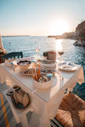 Dinner by the sea at sunset in fira