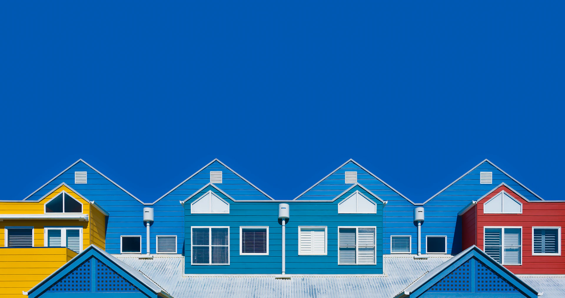 Colorful houses against a vibrant blue sky