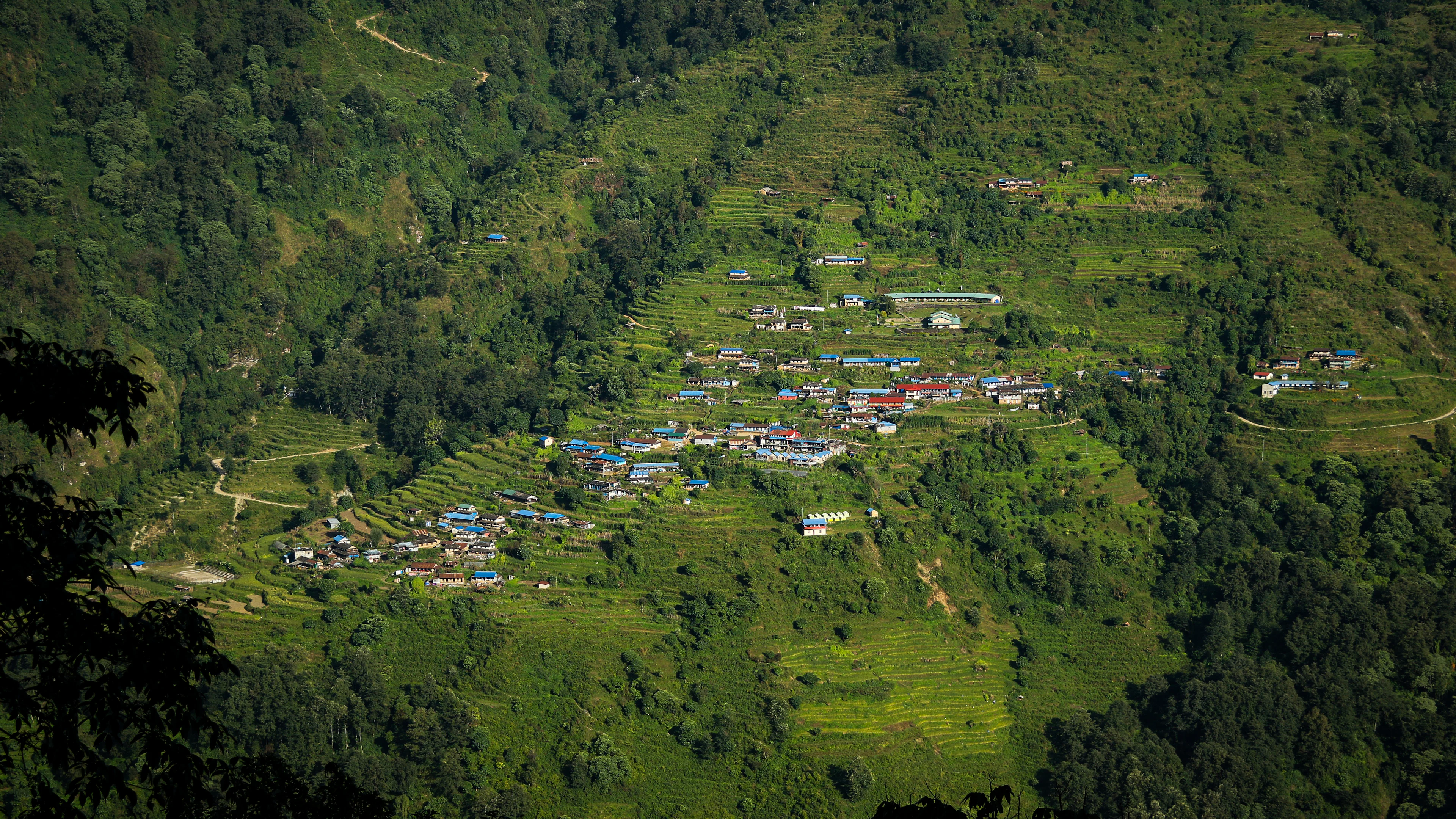 Small settlement in a green mountain valley