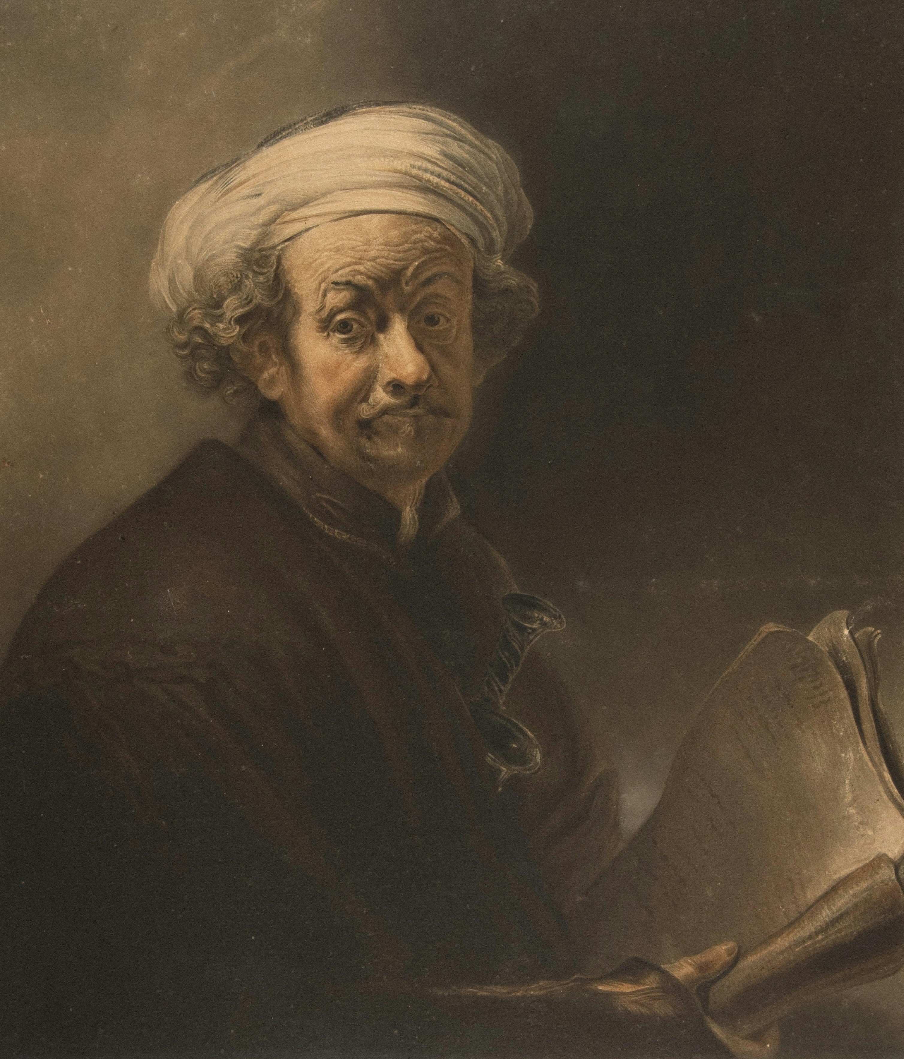 An old man in a turban holds papers
