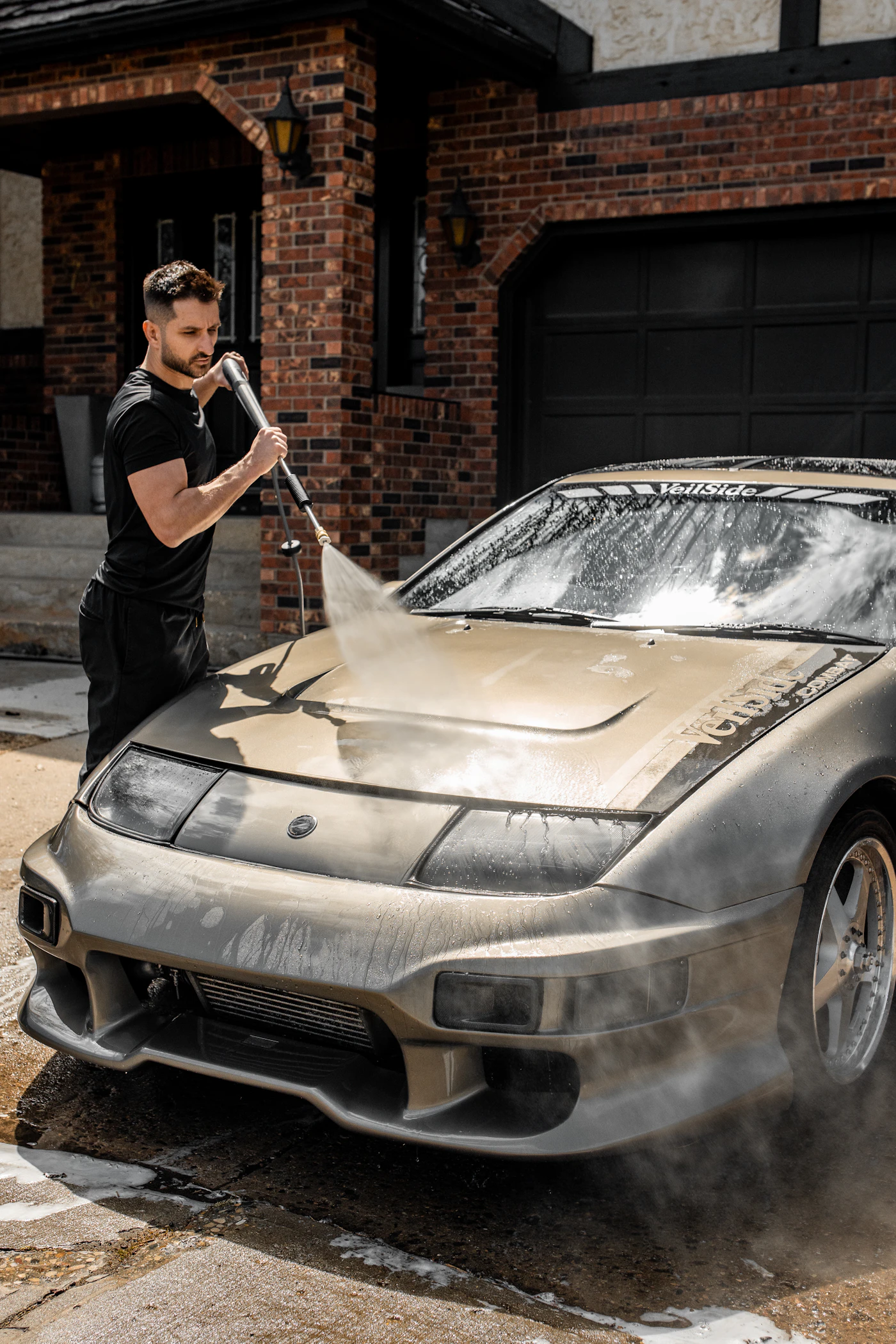 Pressure washing a classic sports car