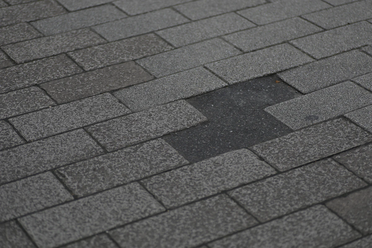 Asphalt shingle roof with missing shingles