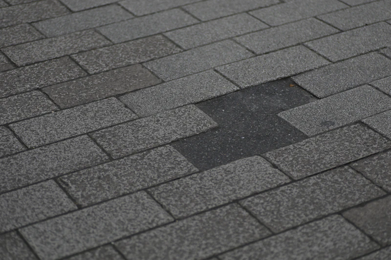 Asphalt shingle roof with missing shingles