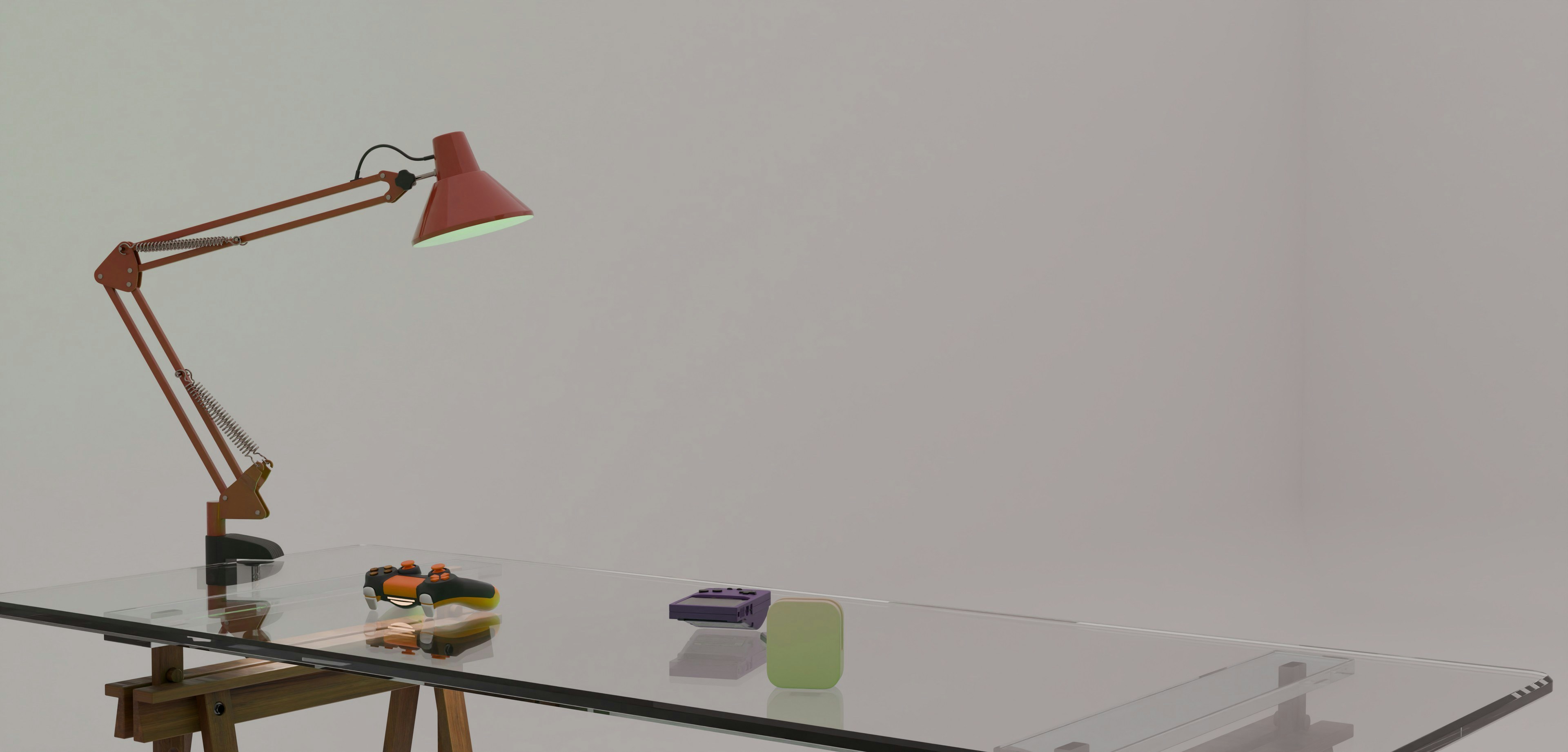 Adjustable red lamp and small objects on a glass table.
