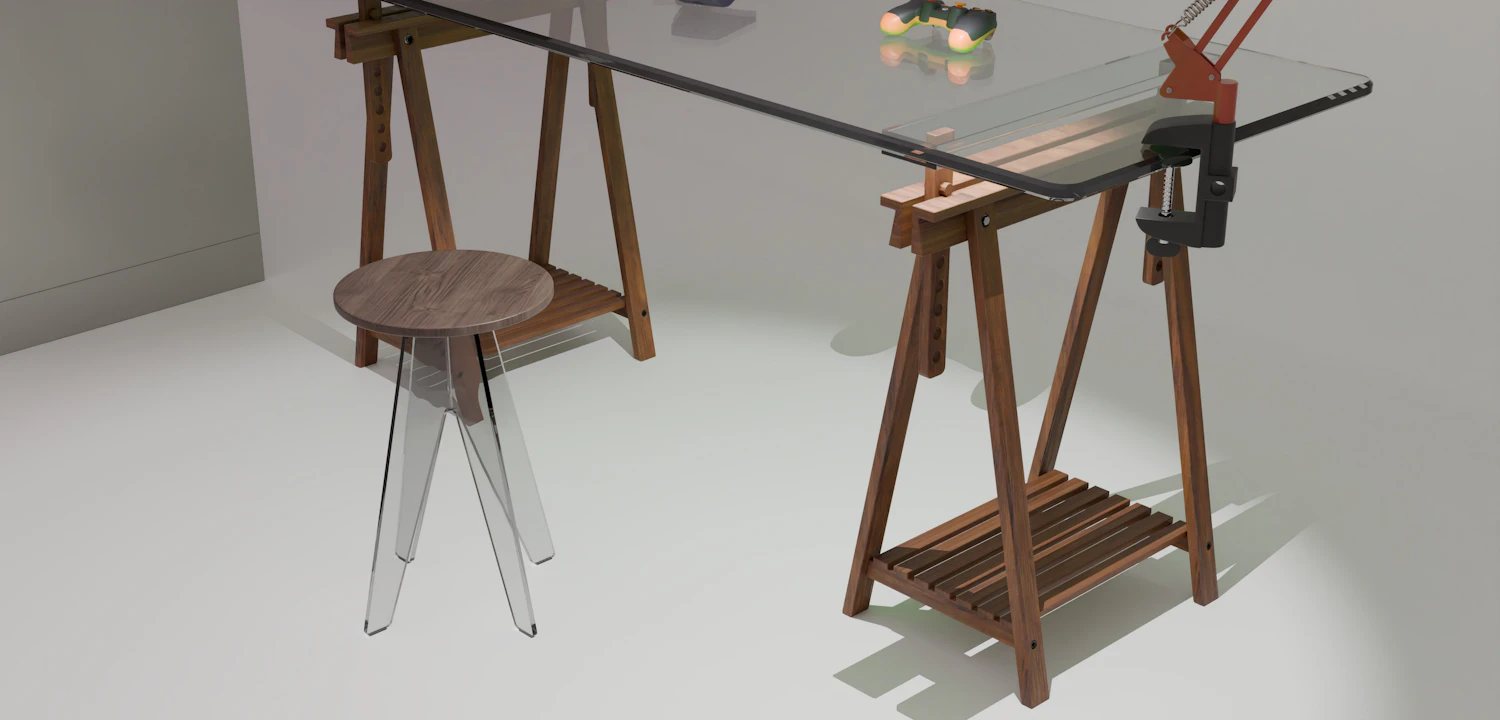 A glass-topped drafting table on timber trestles beside a stool