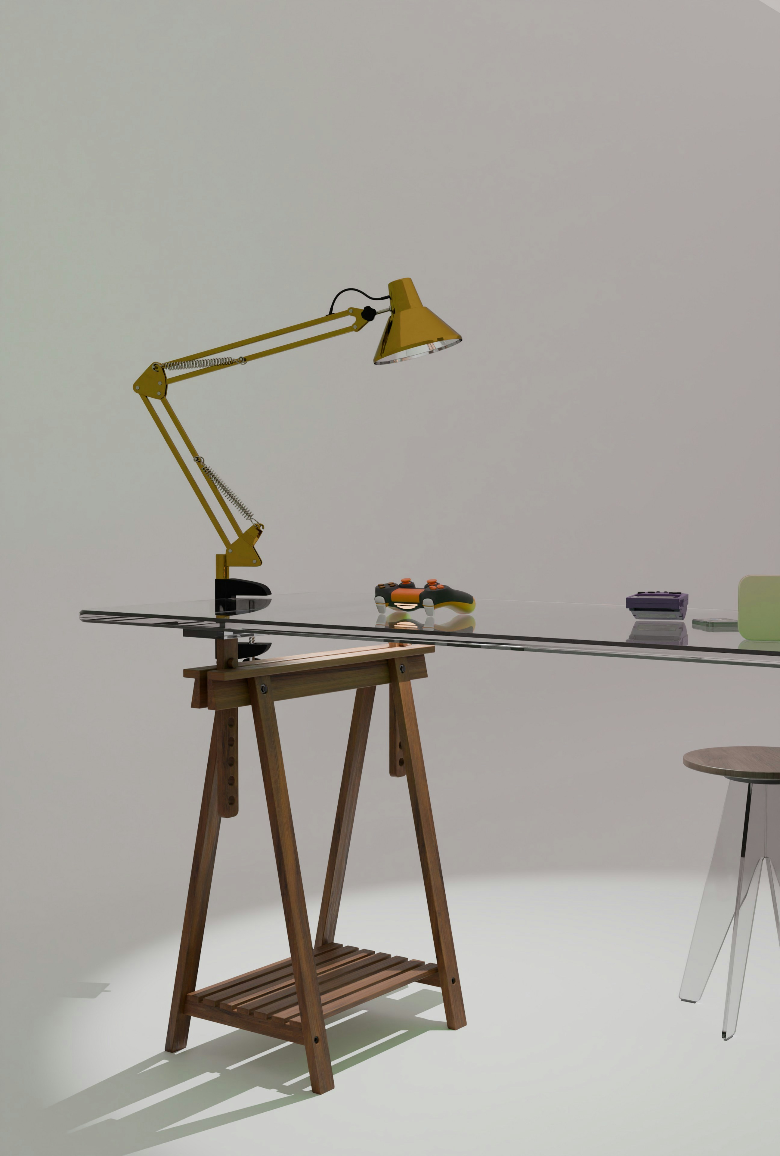 Yellow desk lamp on a glass table with wooden trestle.