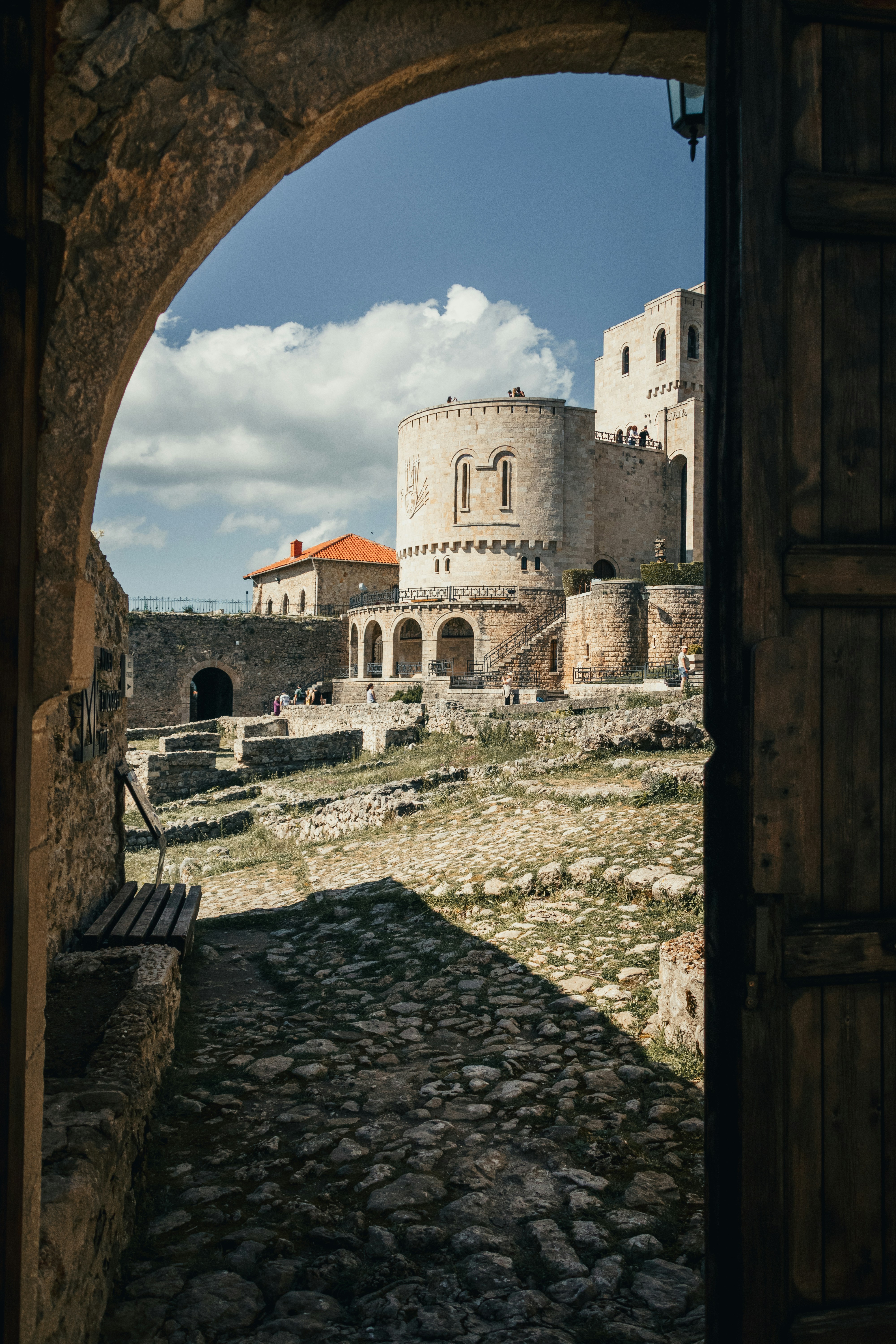 Ancient stone castle viewed through an arched doorway