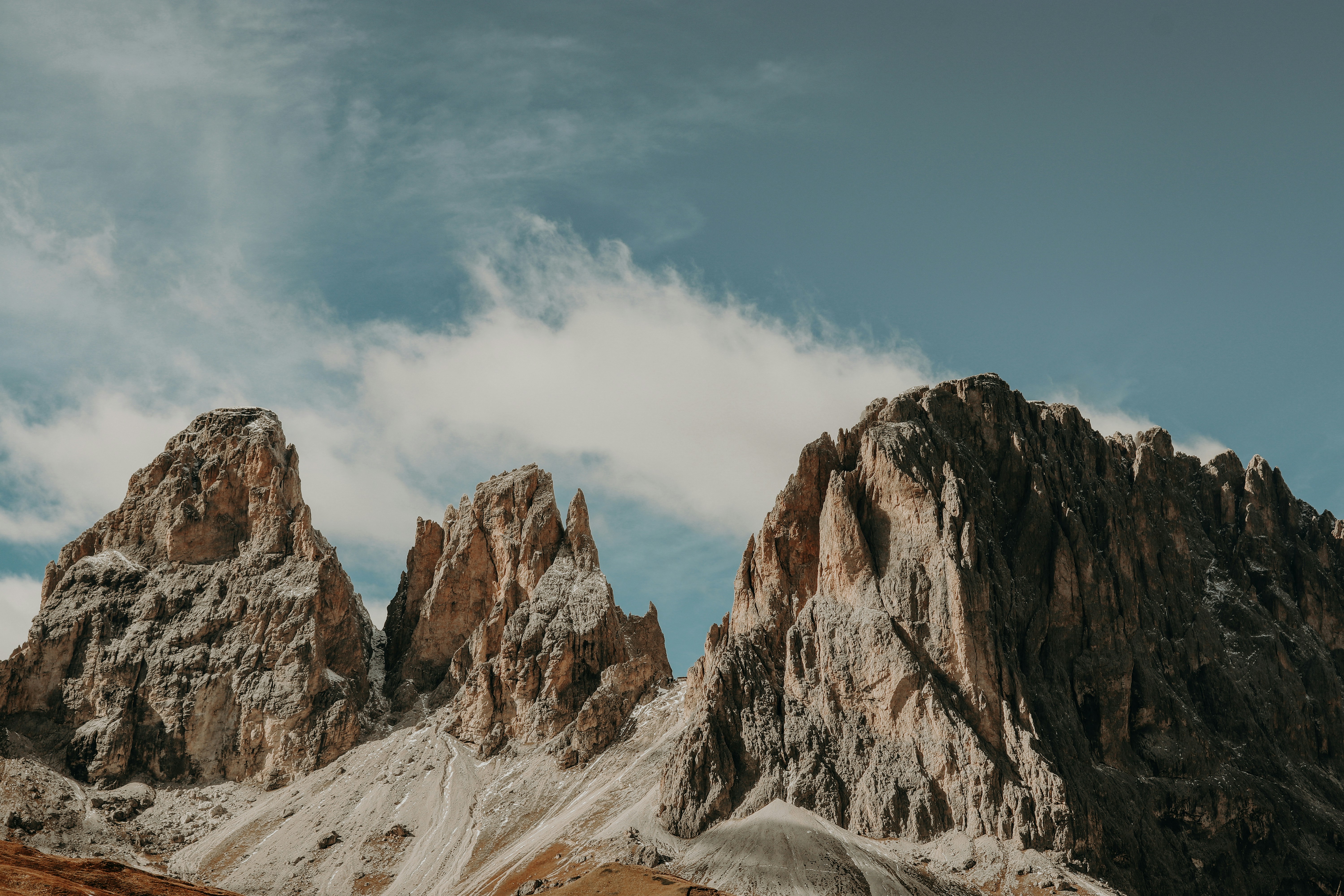 Rocky mountain range under a blue sky