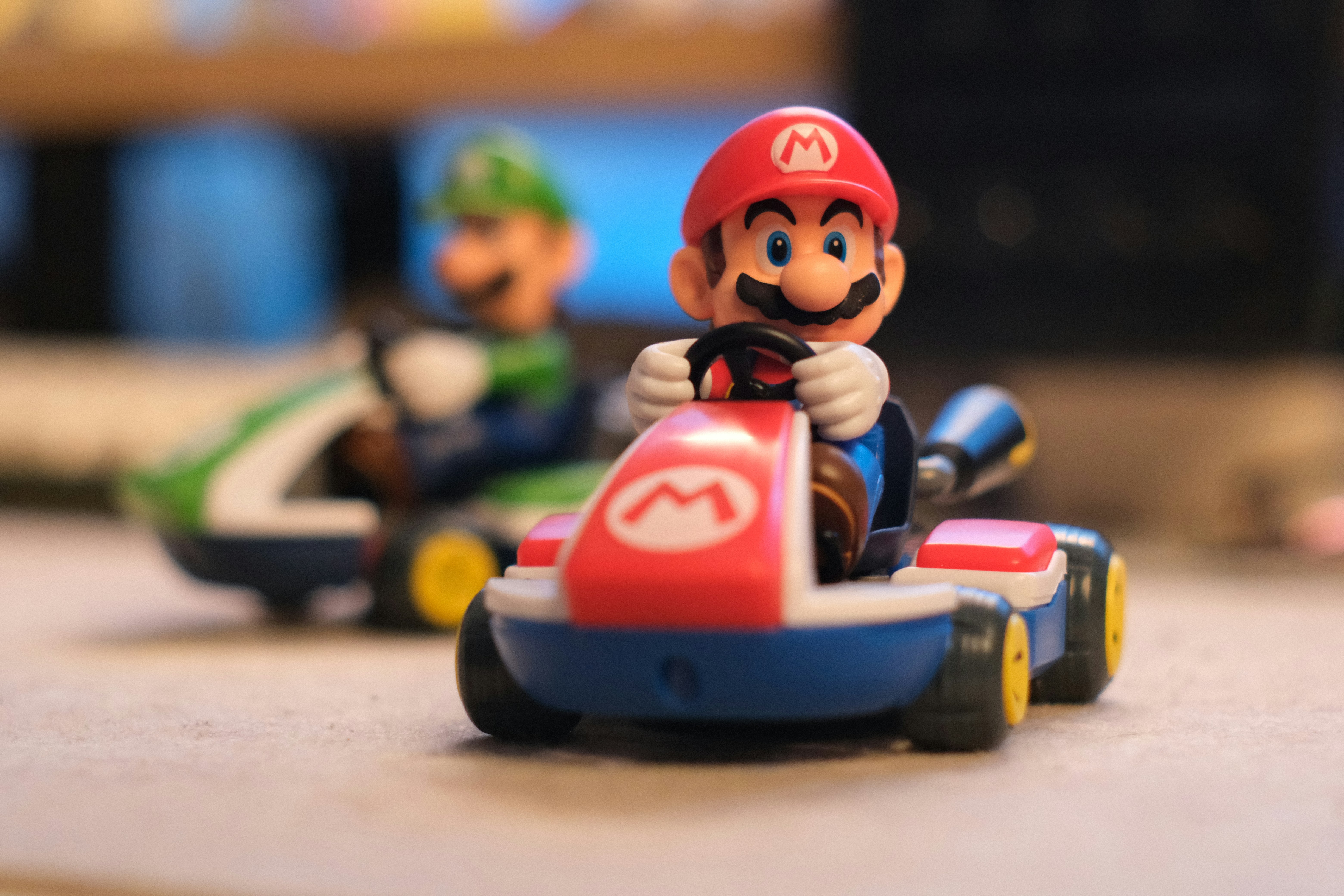 Gaming Mario And Luigi Go Kart Toy Figures On A Surface. 4K Wallpaper #2966