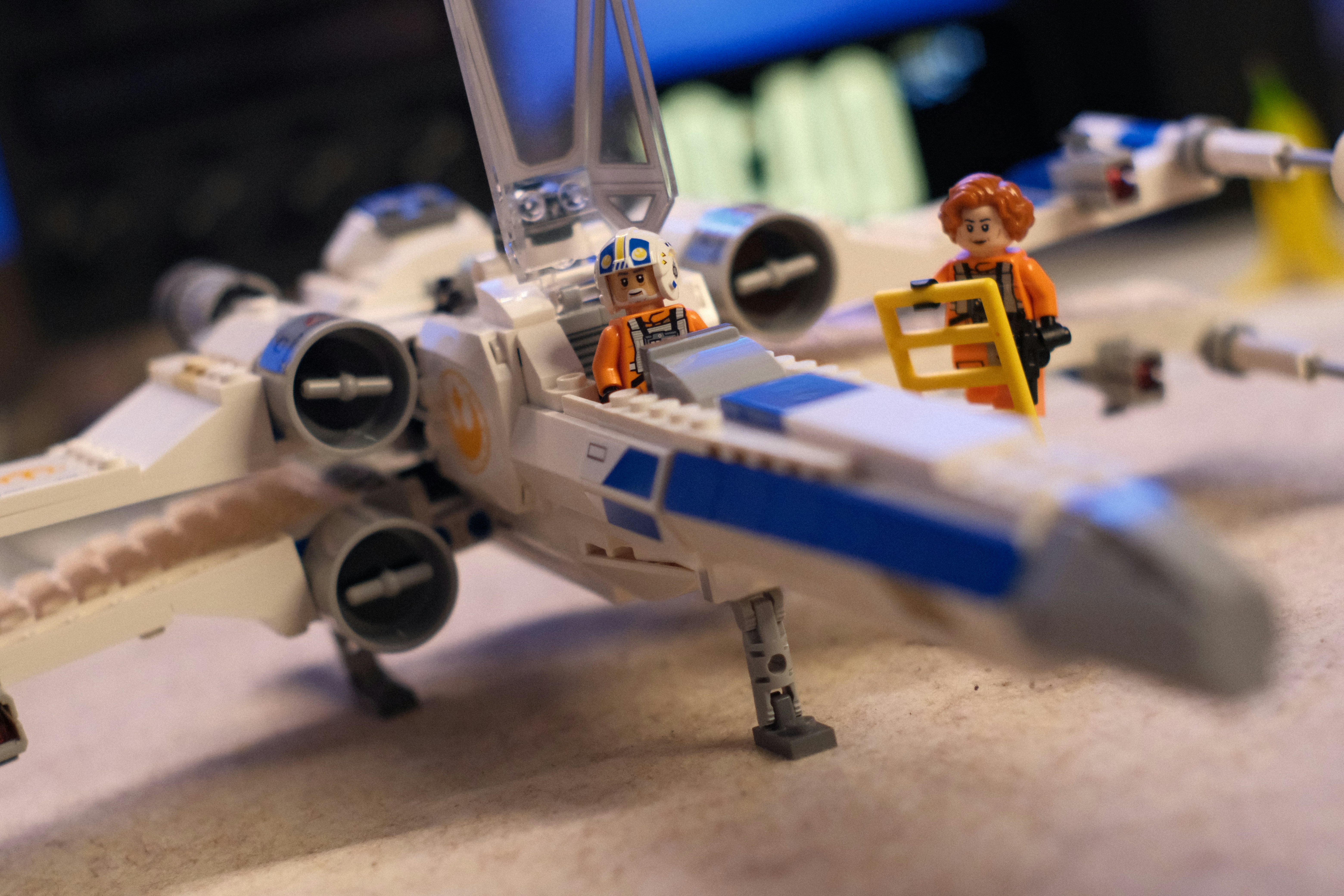 Toy spaceship with pilot figure and ground crew.