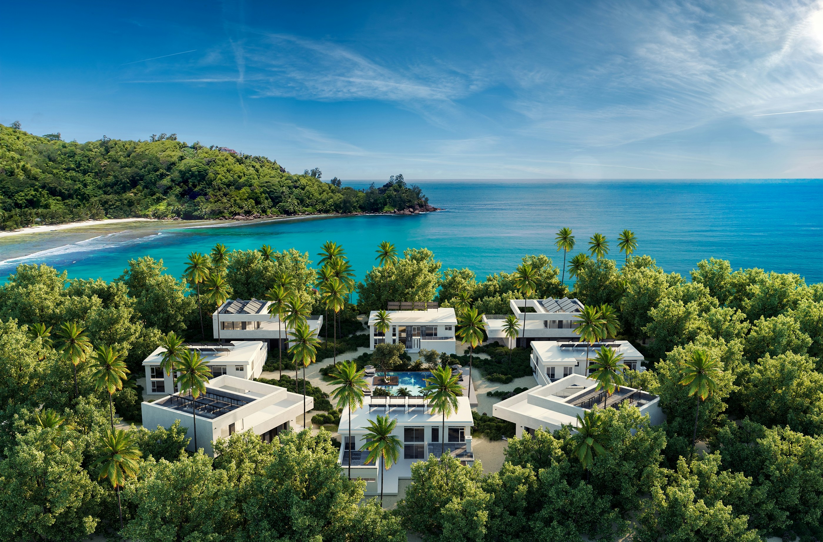 Tropical resort with modern villas overlooking a serene blue ocean.