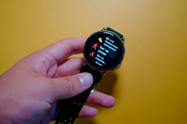 Close-up of a smartphone displaying a health tracking app with charts and personal data
