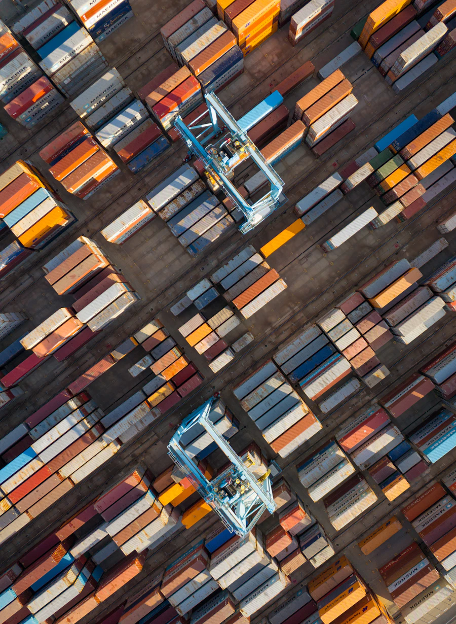 Cargo ship loaded with containers at port, representing Ebor Trading’s international network