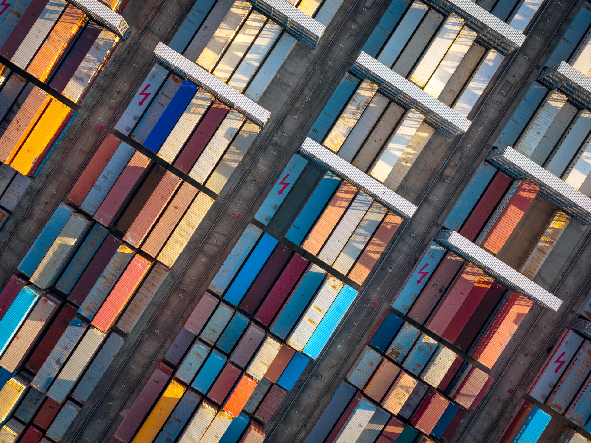Aerial view of colorful shipping containers at a port.