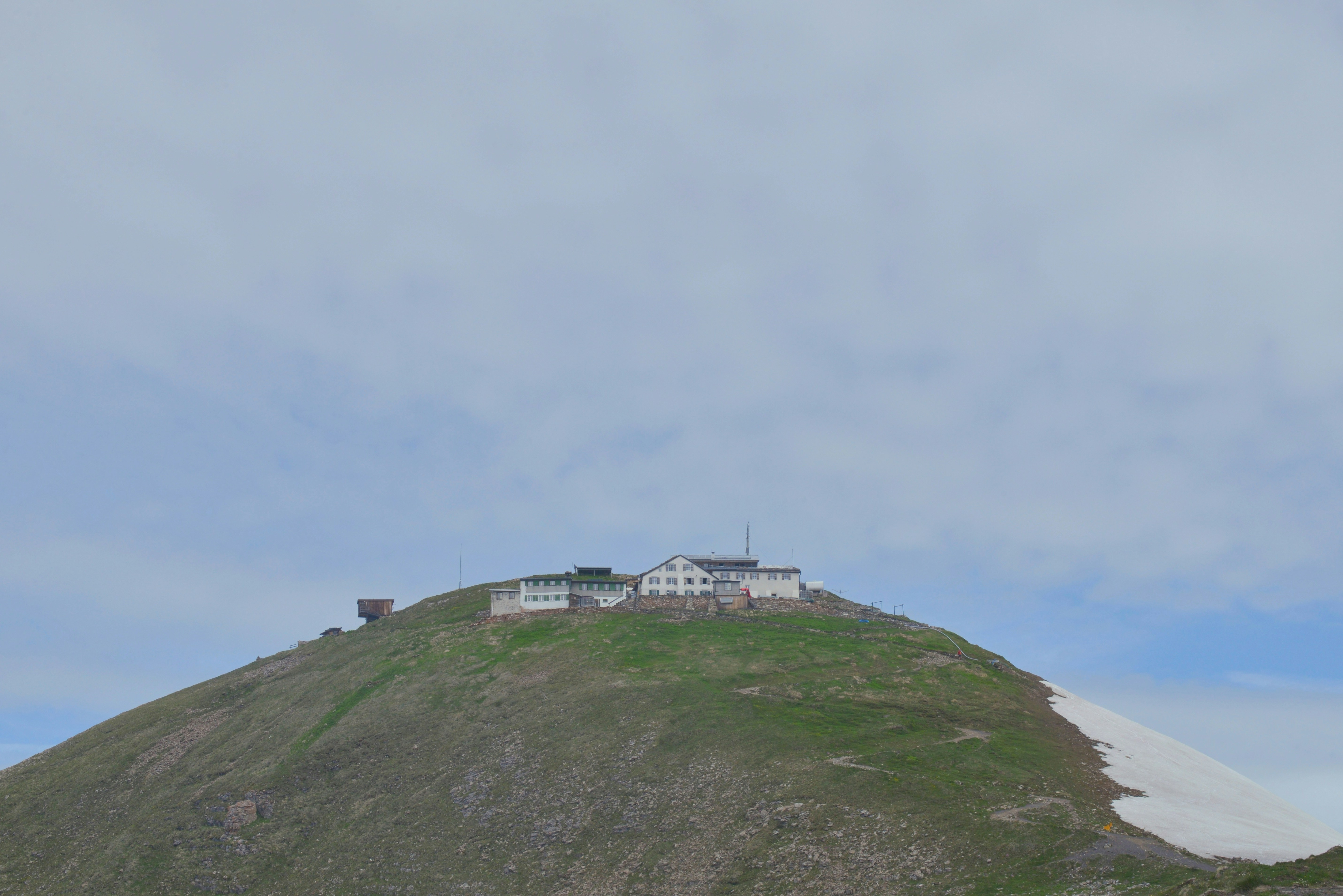A mountain hut resting on the gentle curves of Faulhorn, Swiss Alps