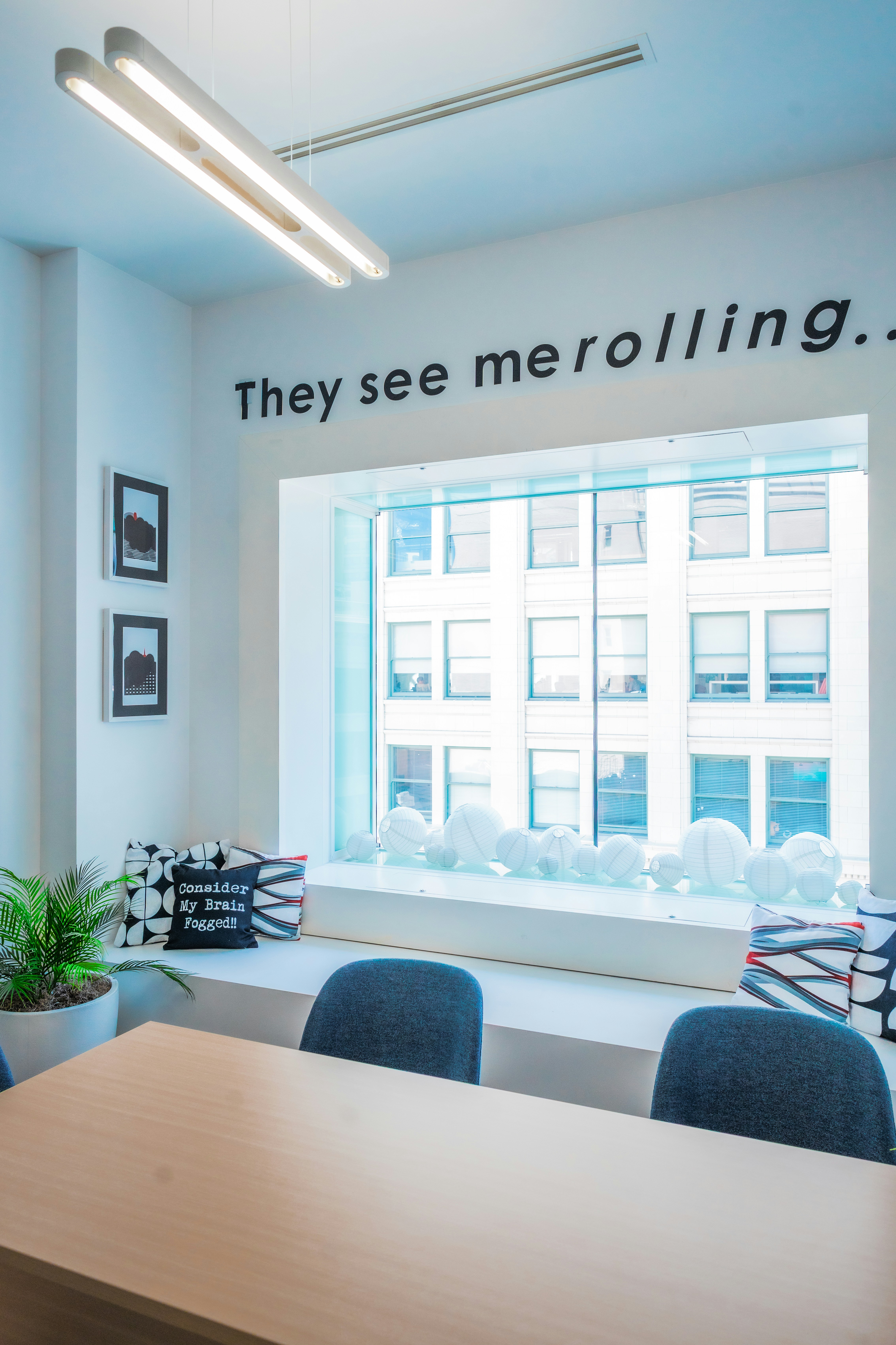 Office seating by a window overlooking the city