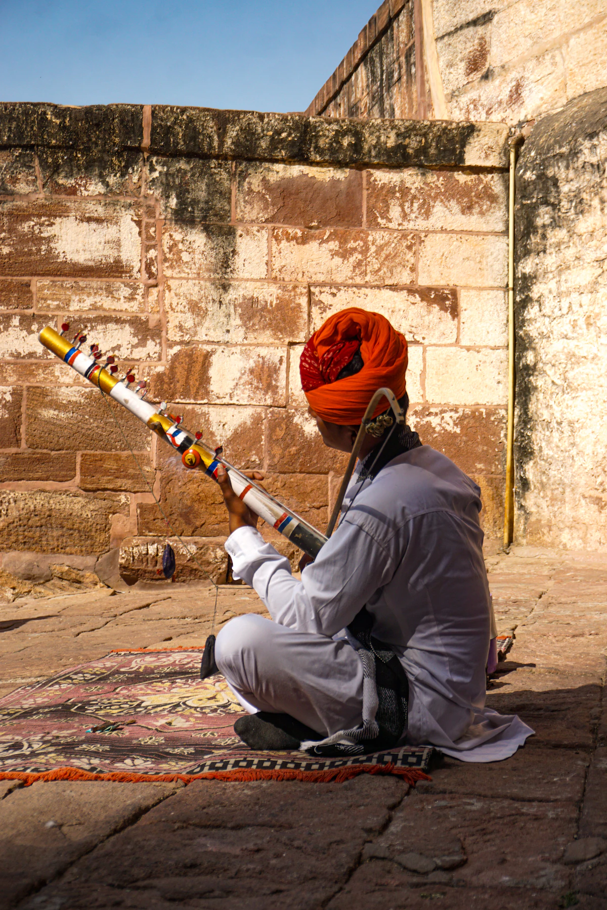Rajasthani folk musician in an orange turban