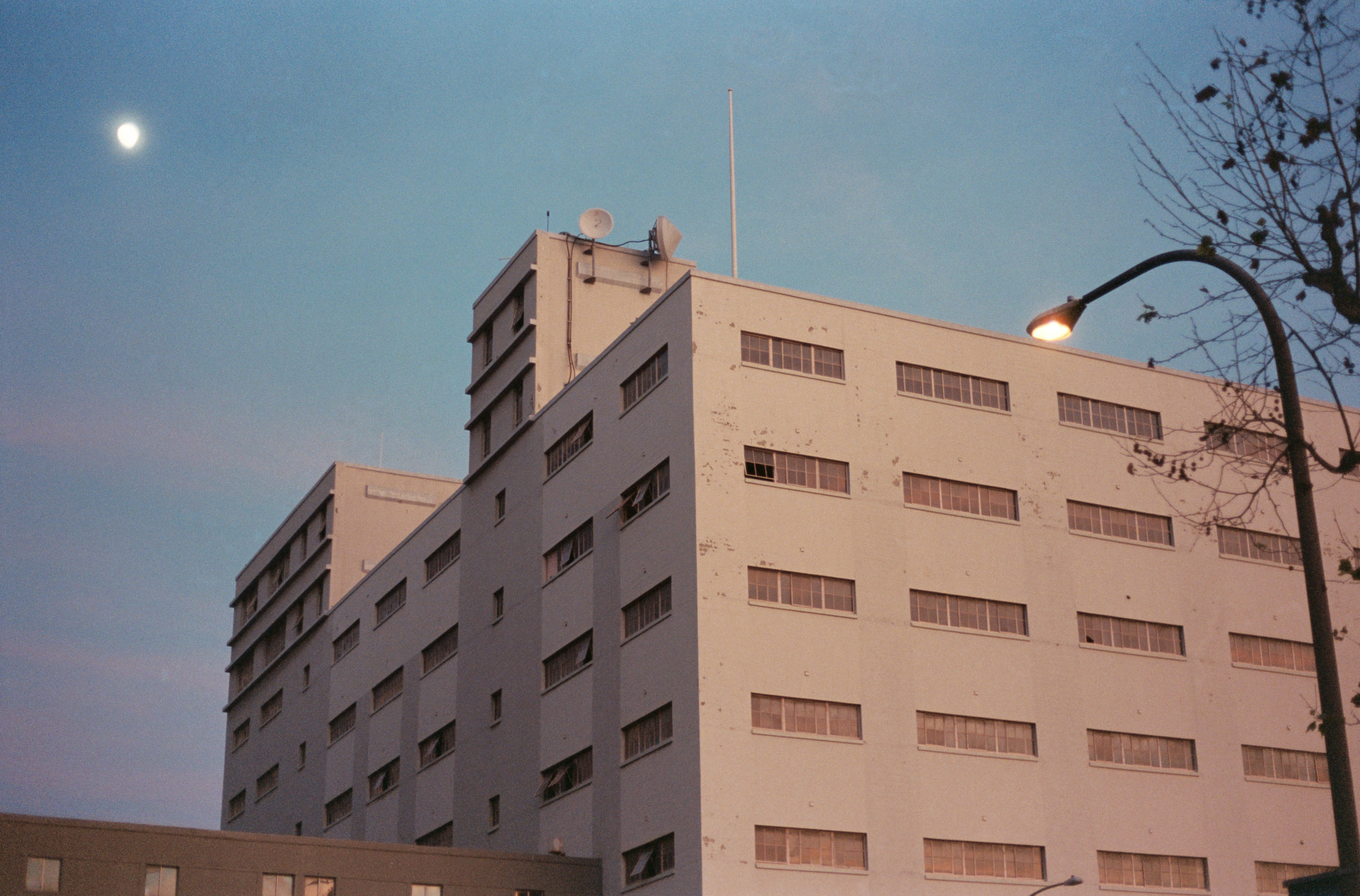 Tall white building and streetlamp