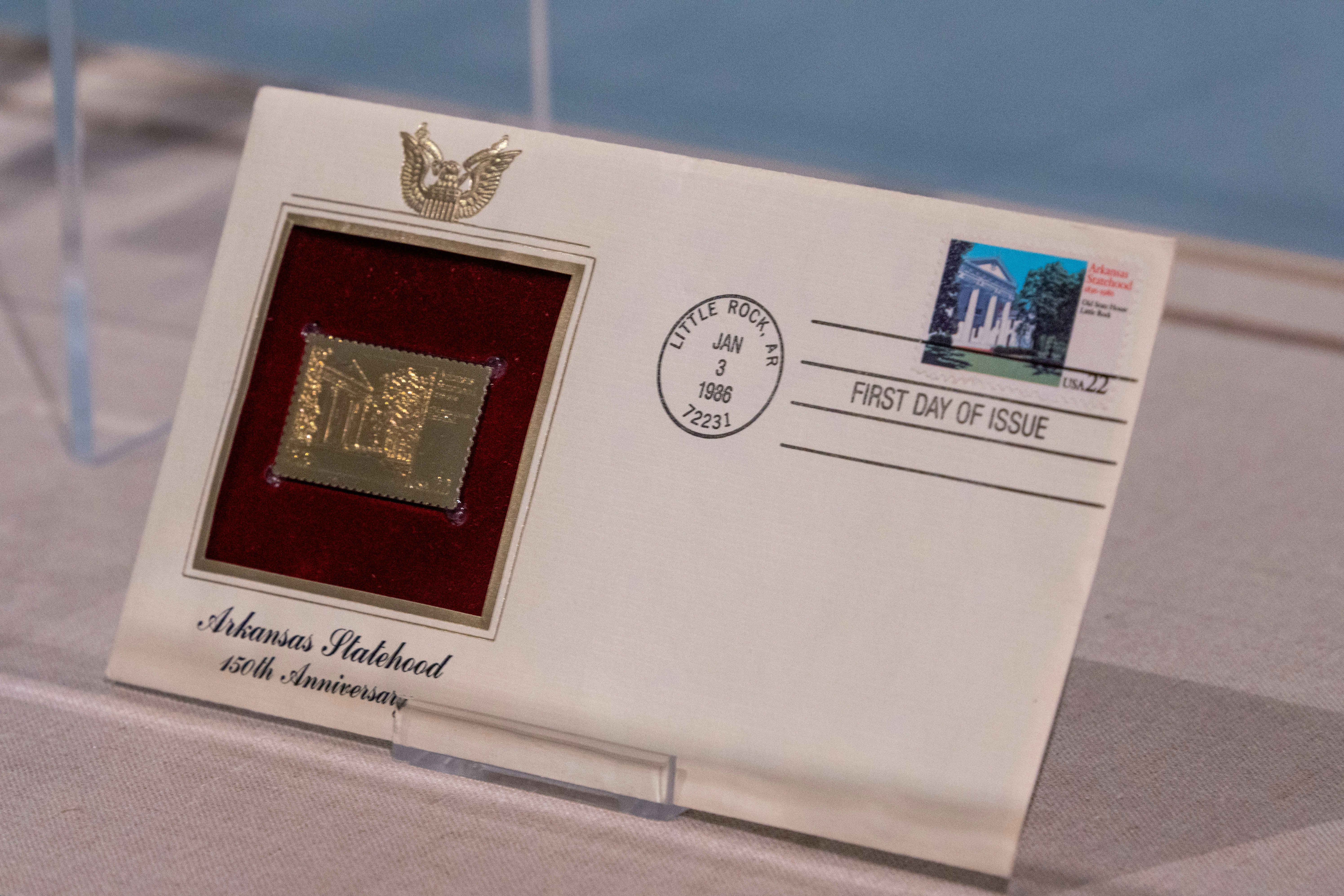 First day cover with arkansas statehood gold commemorative stamp.