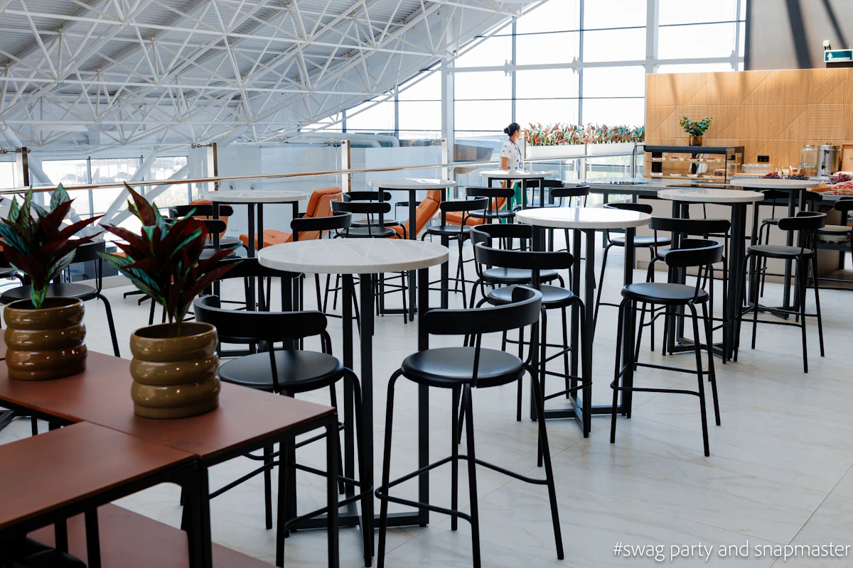 Seating and soft lighting inside an airport business lounge