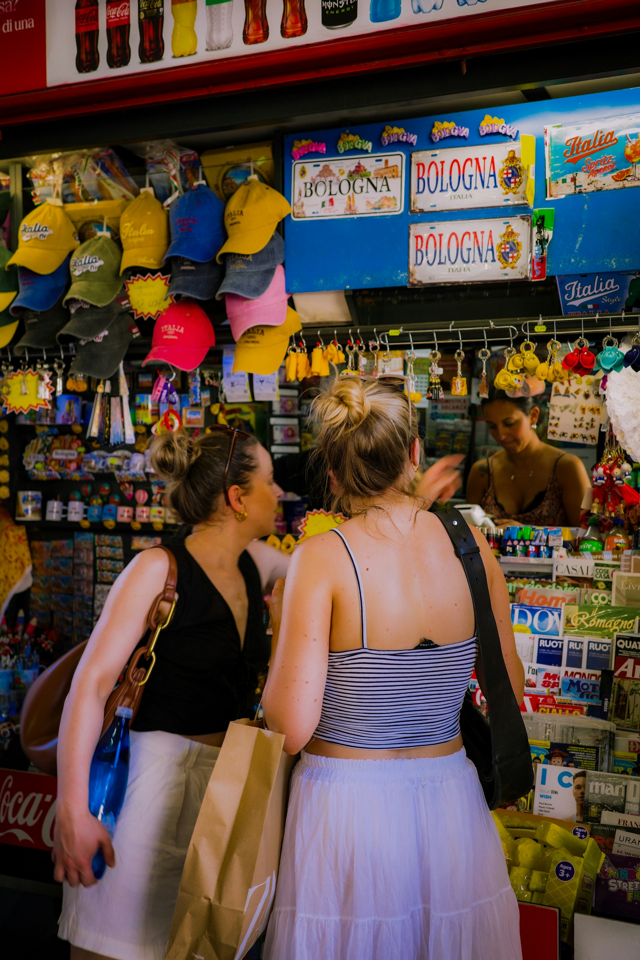 Two women browsing items at a souvenir shop