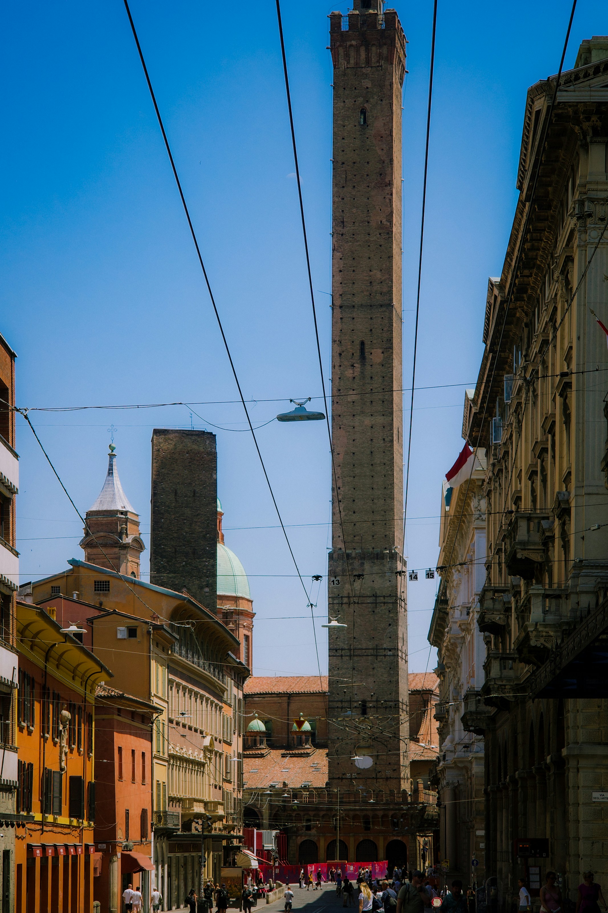 Historic towers of bologna standing tall under a clear sky