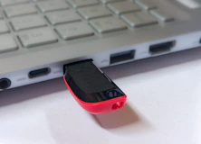 Usb flash drive plugged into a silver laptop