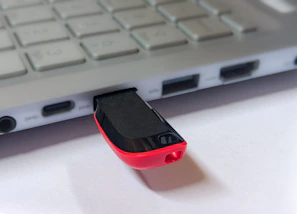 Usb flash drive plugged into a silver laptop