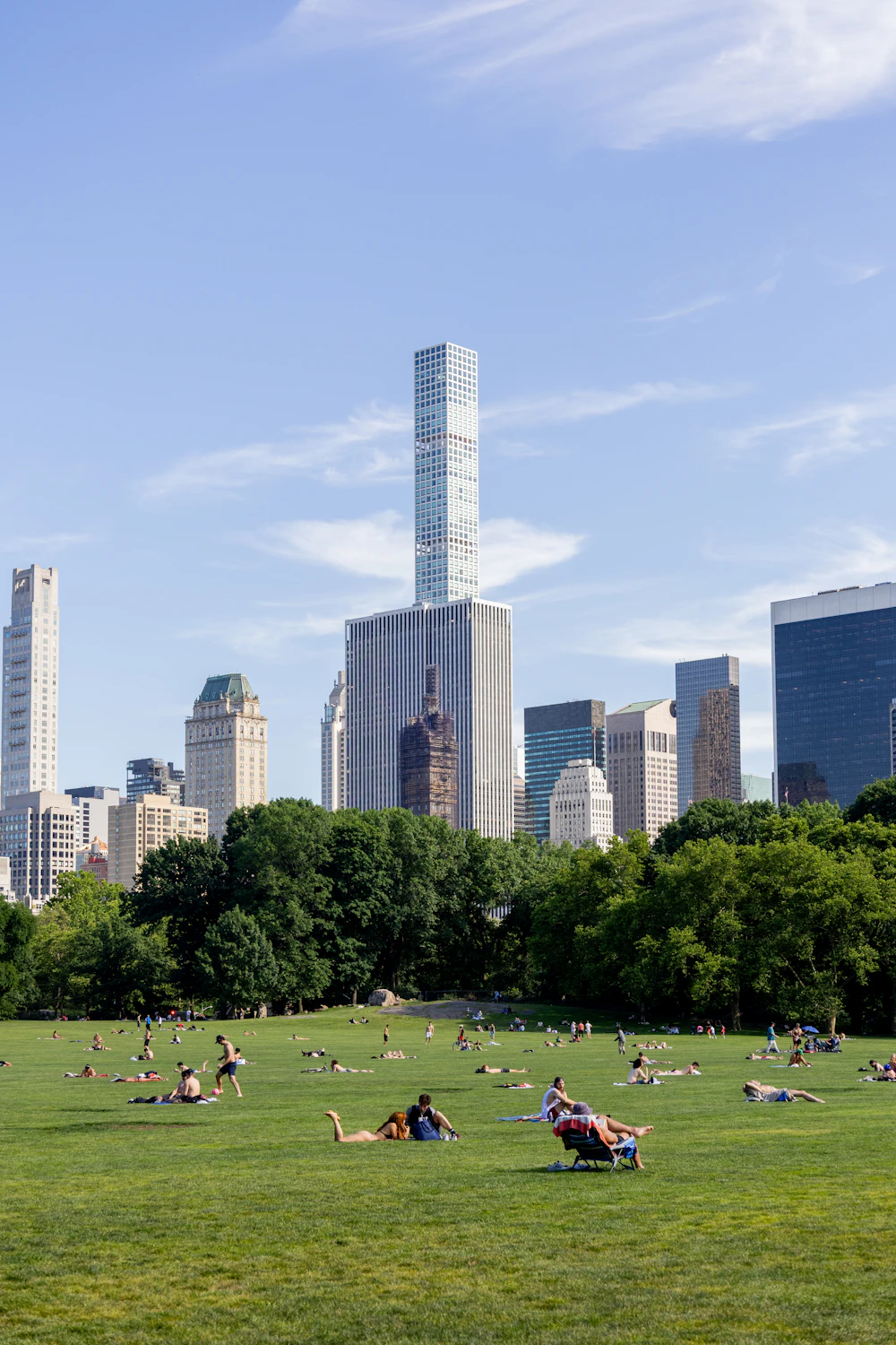 Central Park’s green lawn beneath the Manhattan skyline