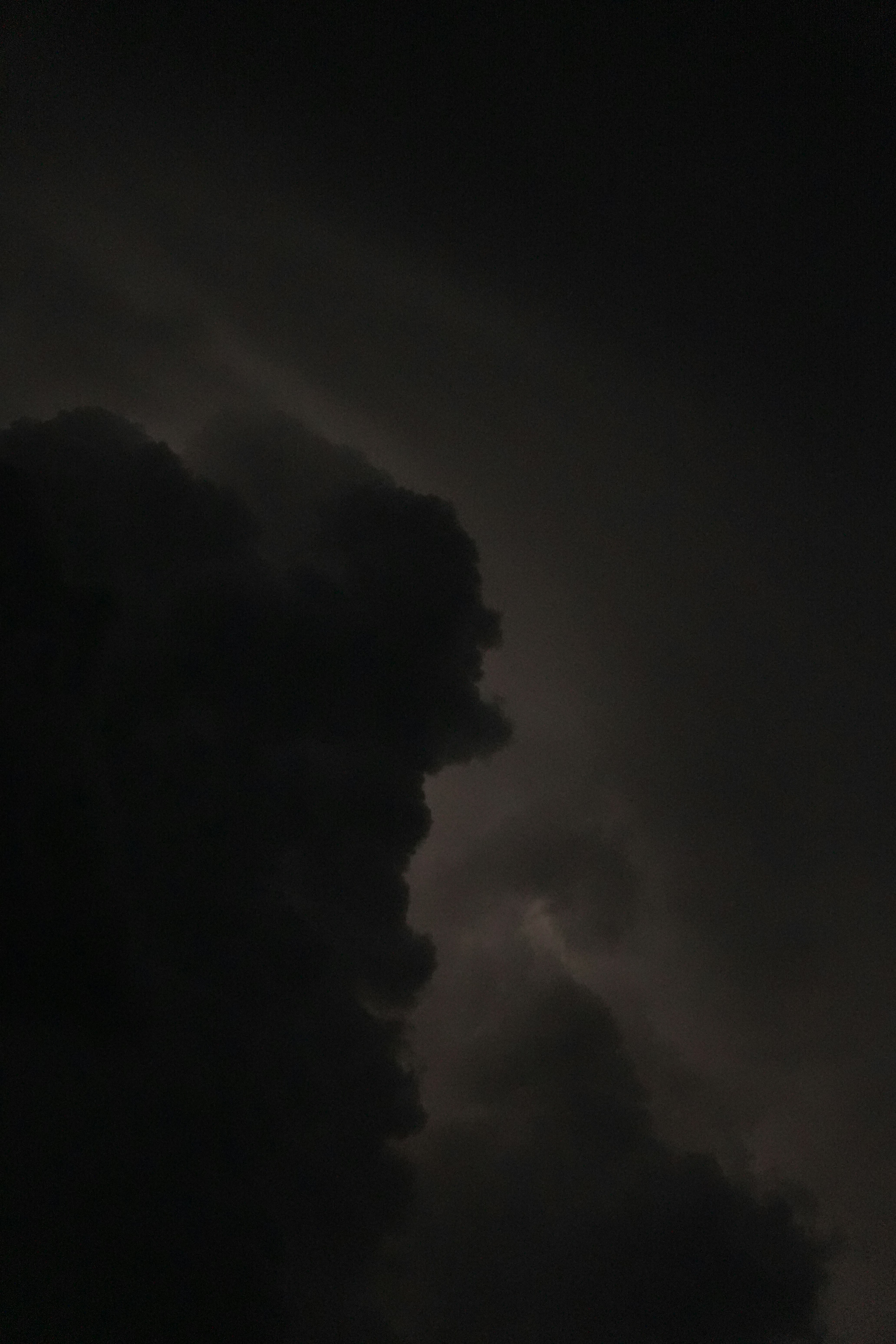 Dark, ominous clouds fill the night sky