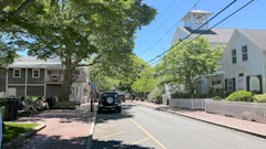 A quaint New England main street with a church steeple