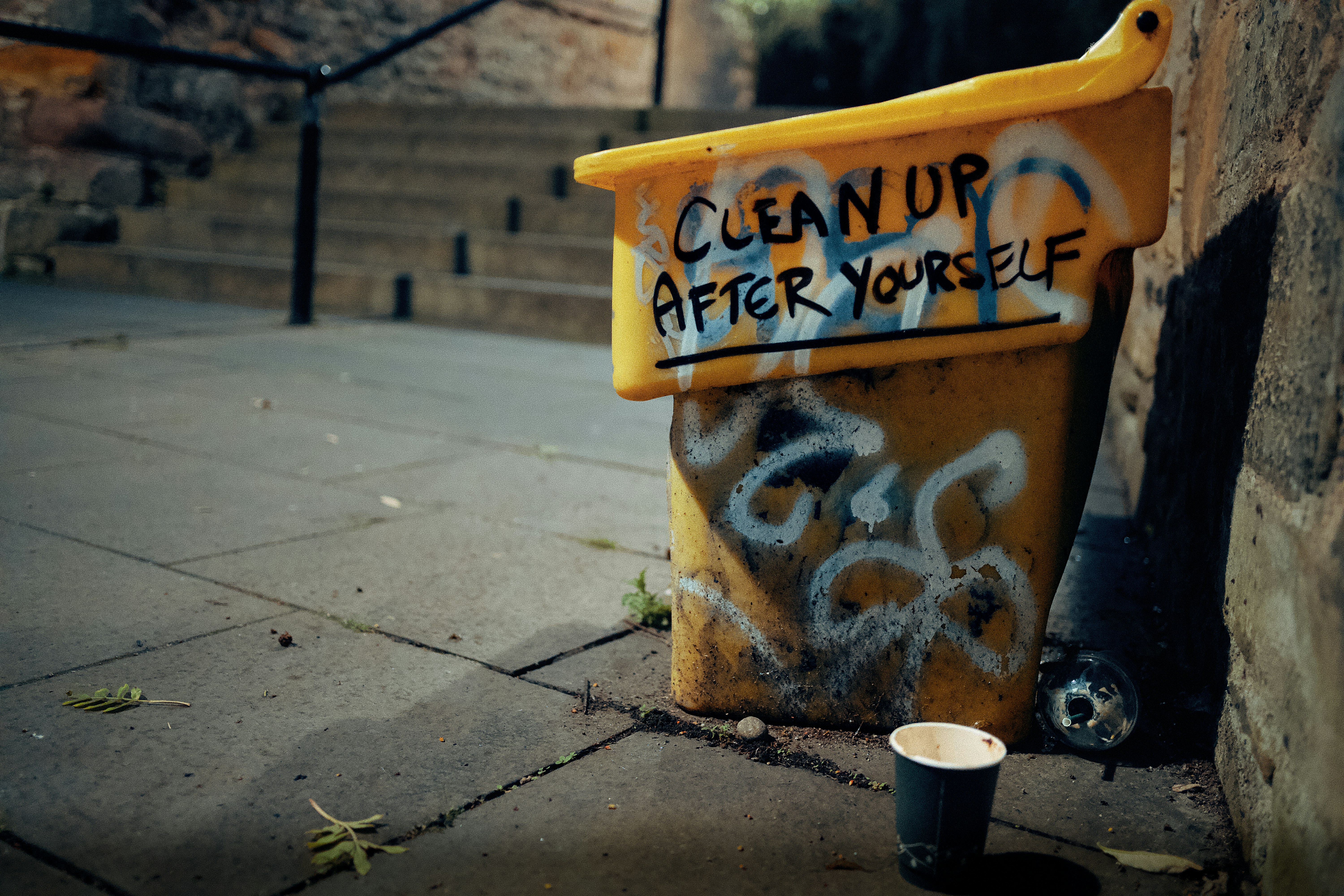Filthy, grime-covered trash bin with visible buildup before professional cleaning