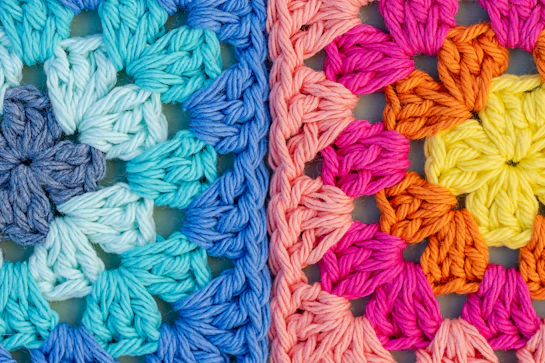Colorful crochet granny squares in cool and warm tones