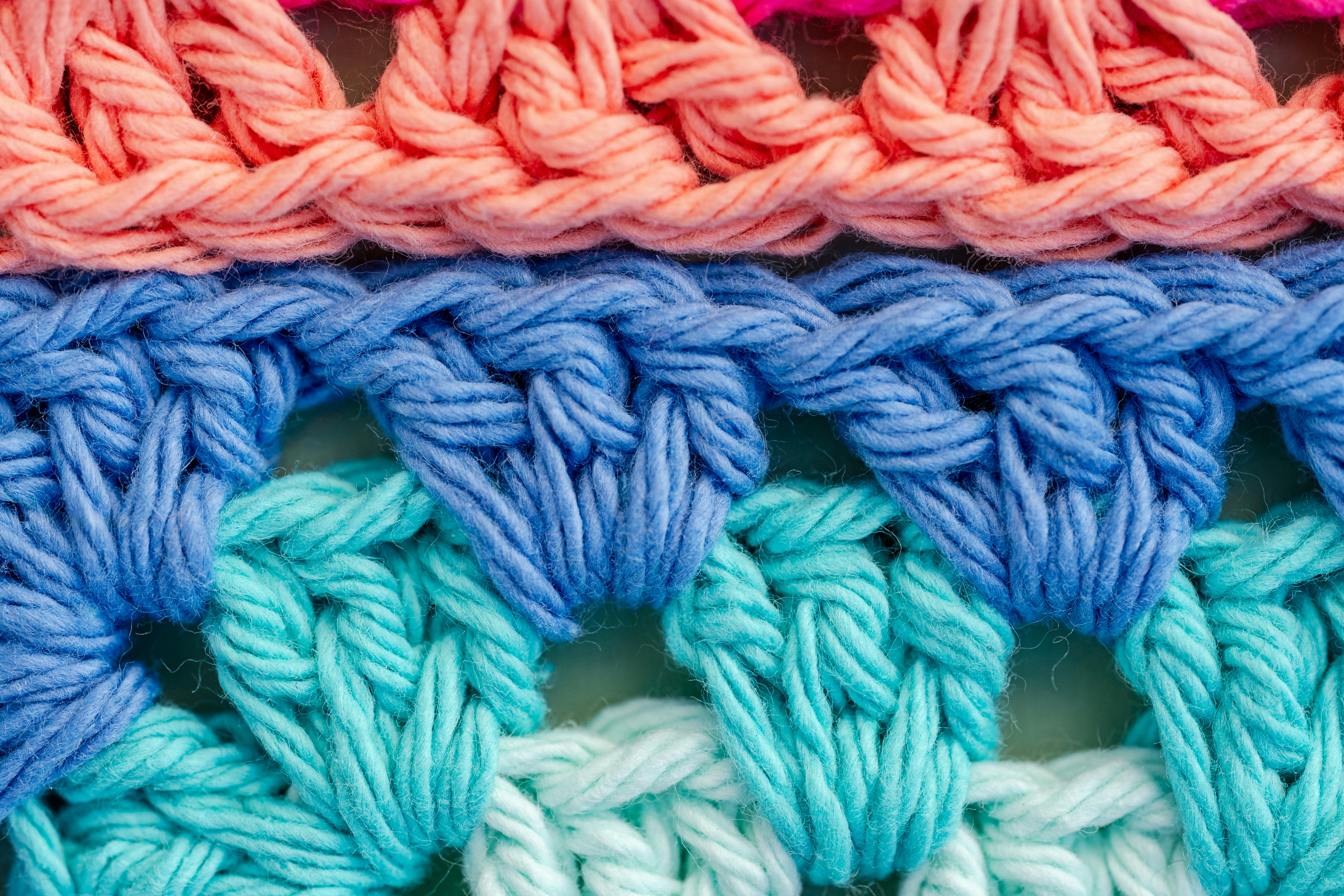 Colorful crocheted fabric with intricate stitches and vibrant hues.
